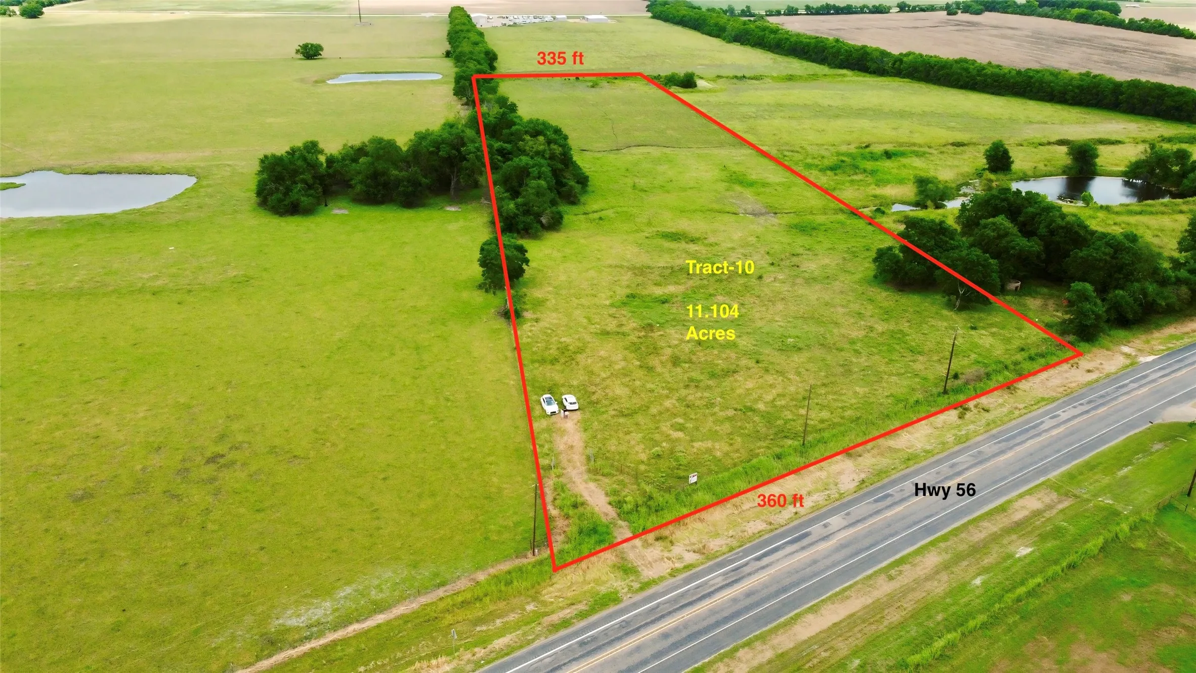 Aerial view of property and surrounding area featuring property boundaries highlighted