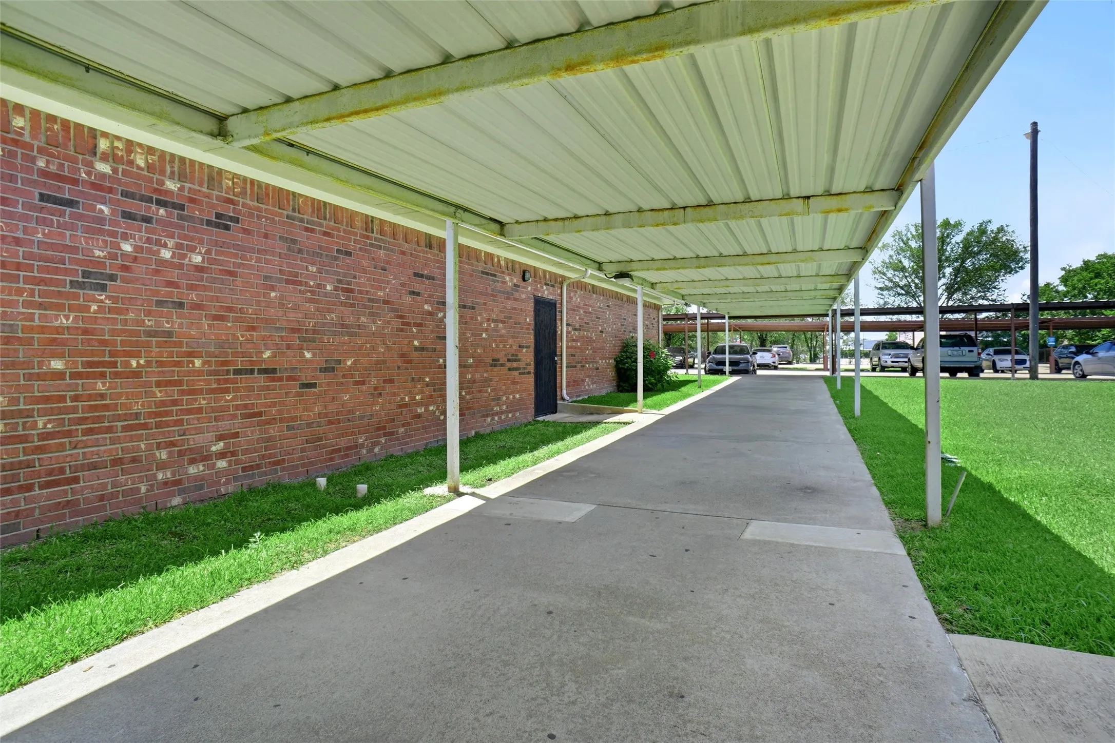 Covered path to the building from the parking lot.