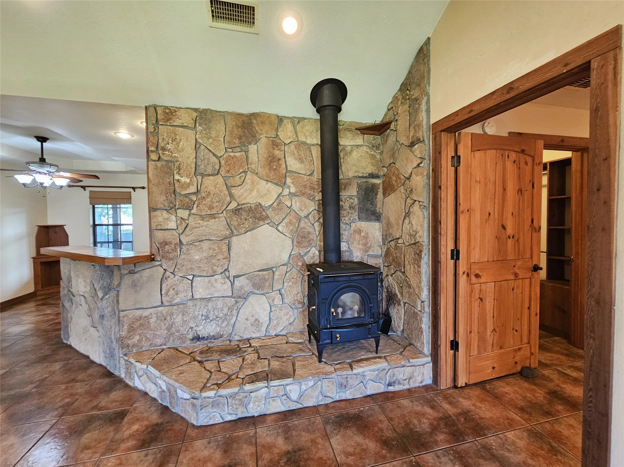 Glass front wood stove in LR