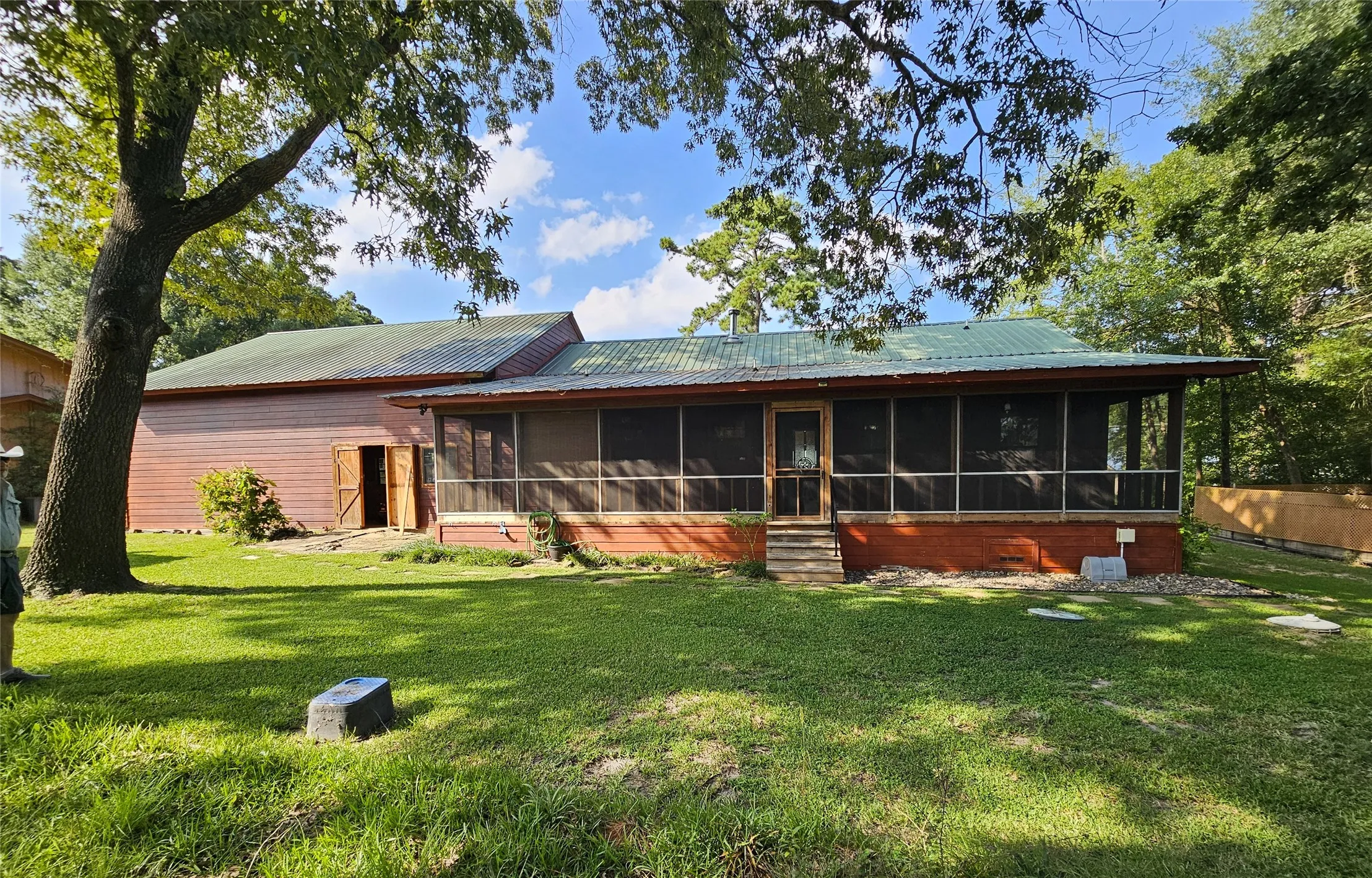 Rear Screened Porch, back side of shop space has double doors