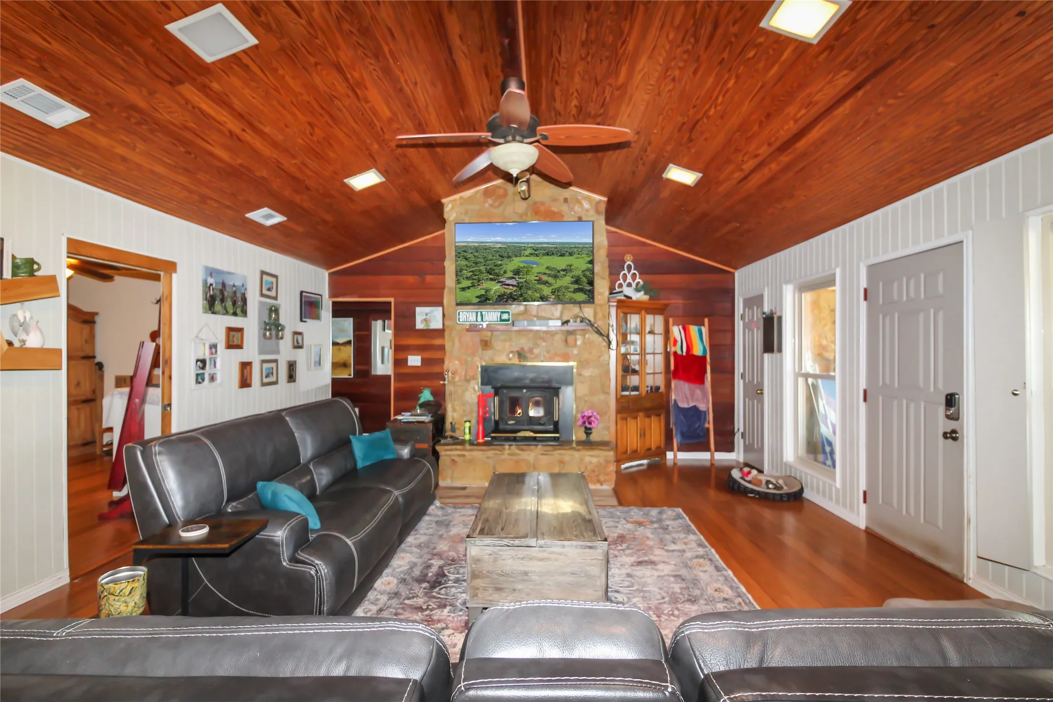 Vaulted wood-finish ceiling featuring recessed lighting and a ceiling fan