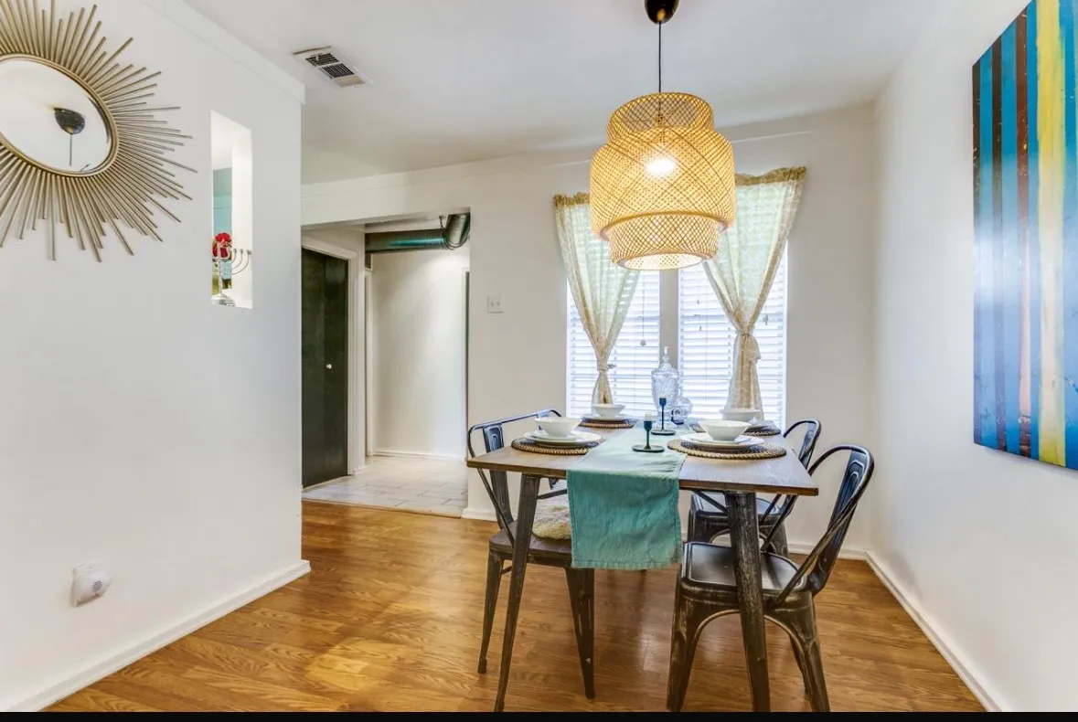 Dining area with wood finished floors and baseboards