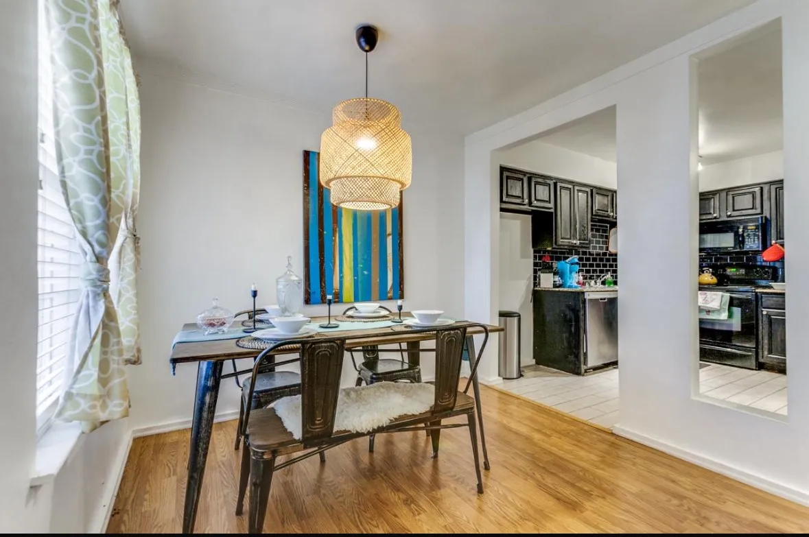 Dining room with light wood finished floors and baseboards