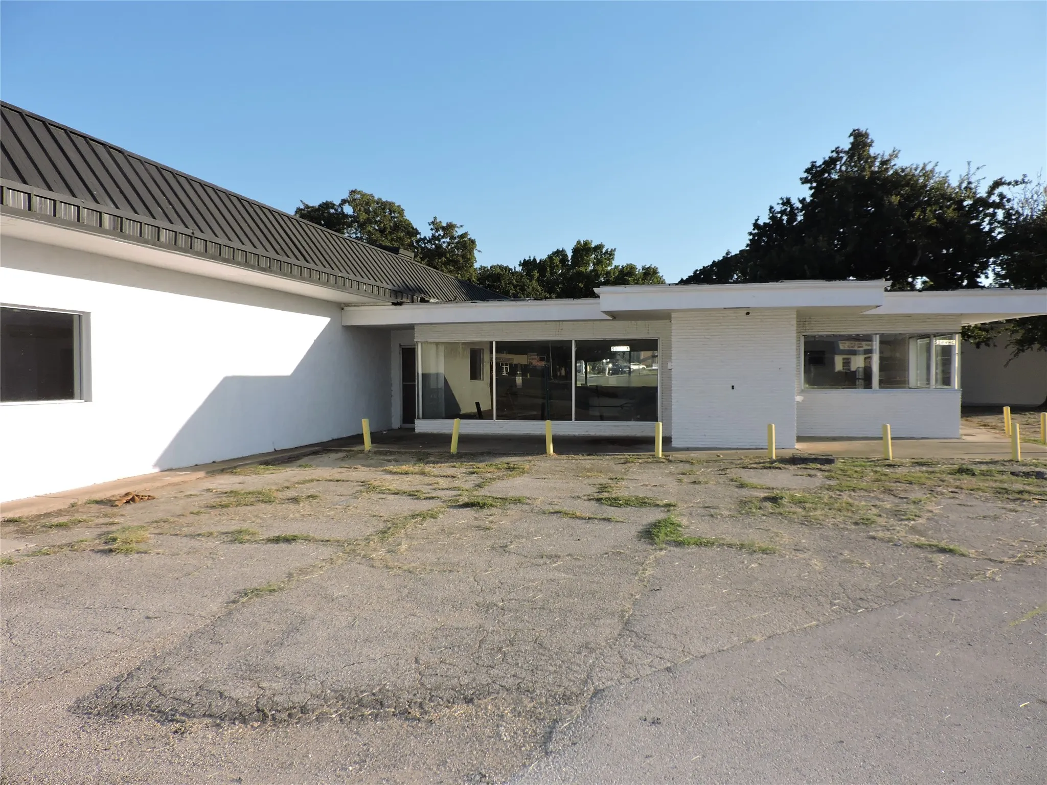Back of property featuring stucco siding