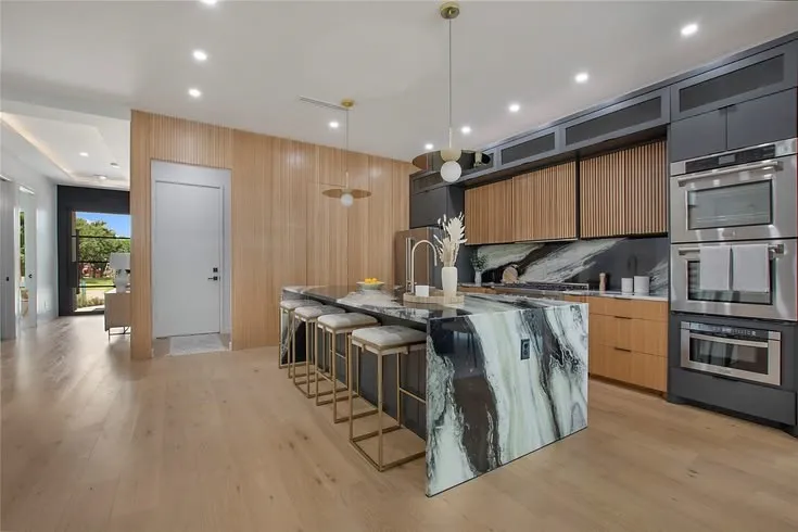 Garage entrance located off kitchen with storage/mud room area