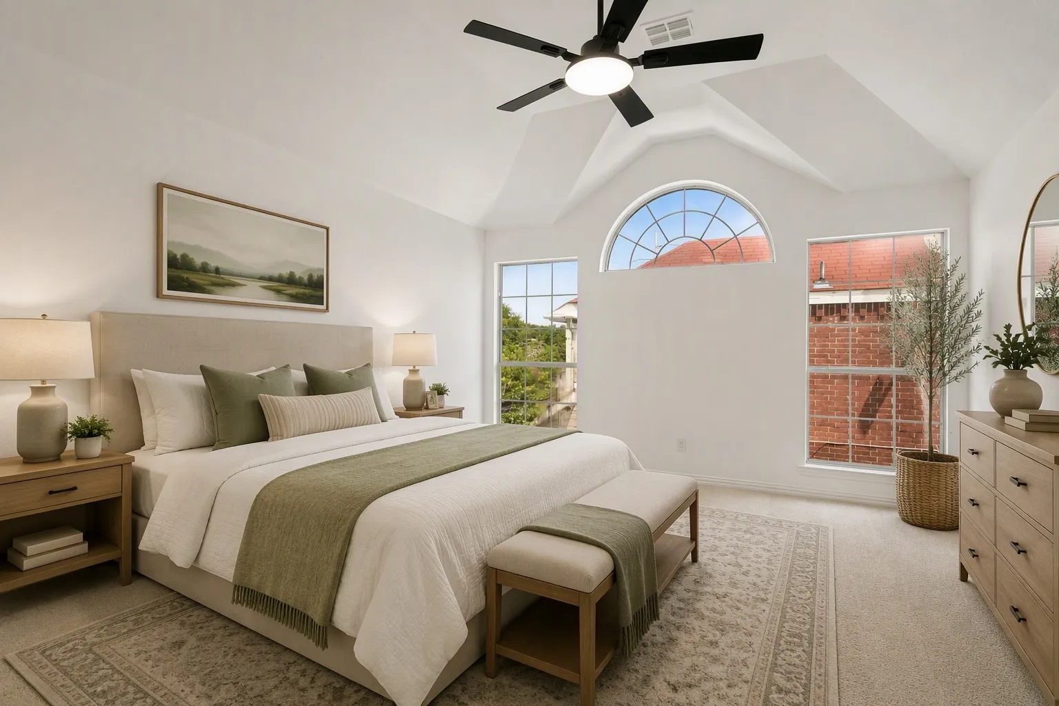 Bedroom featuring vaulted ceilings and a black ceiling fan