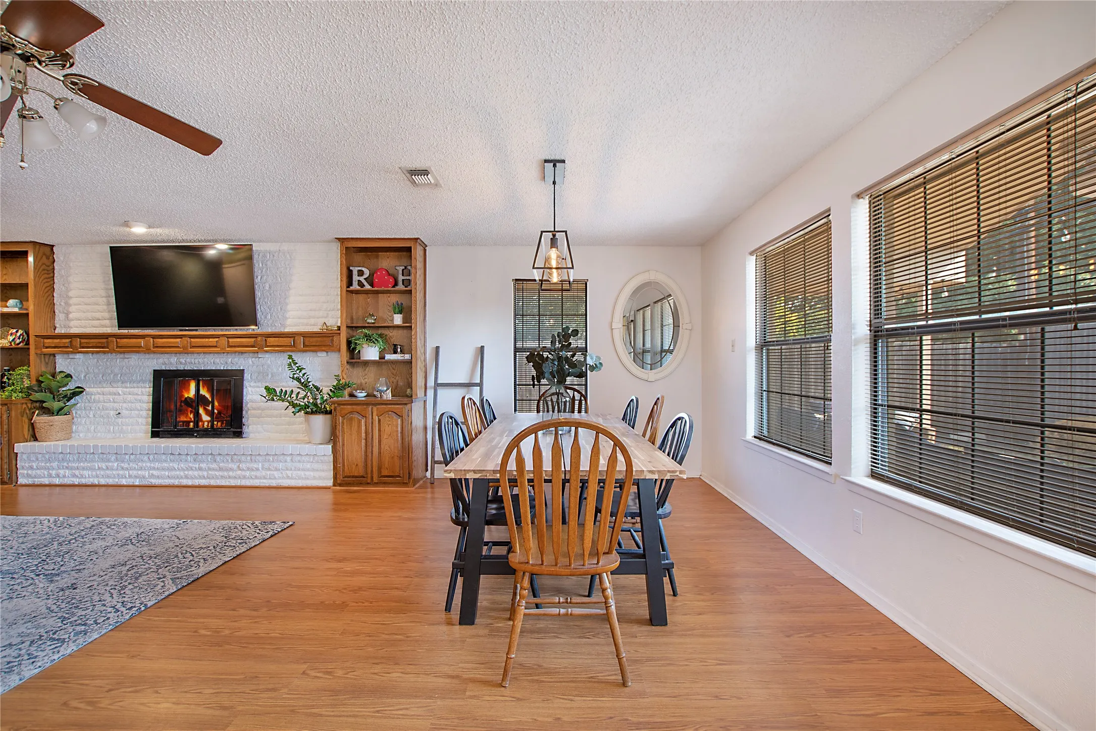 Open concept living space featuring wood-finish flooring