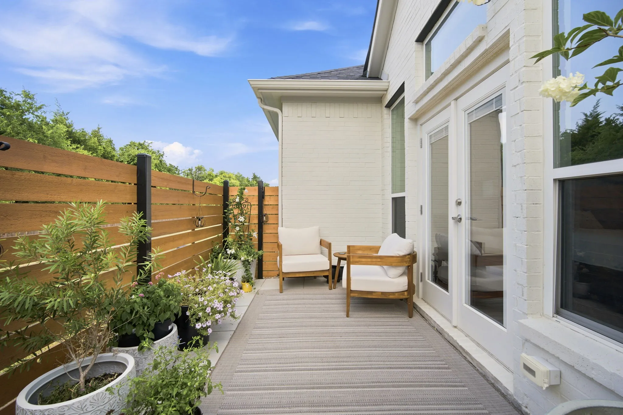 quaint patio off primary suite perfect for morning coffee