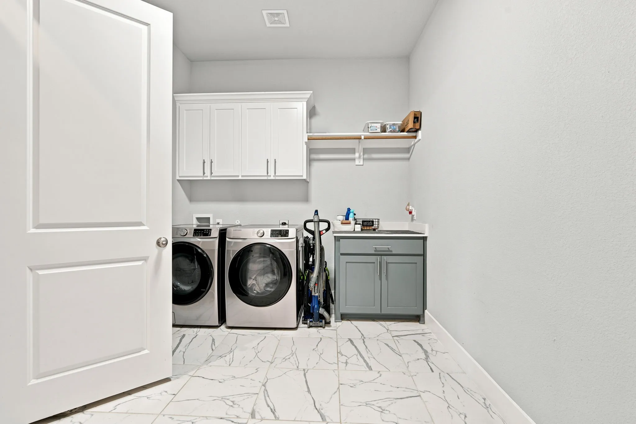 Laundry with access off primary suite