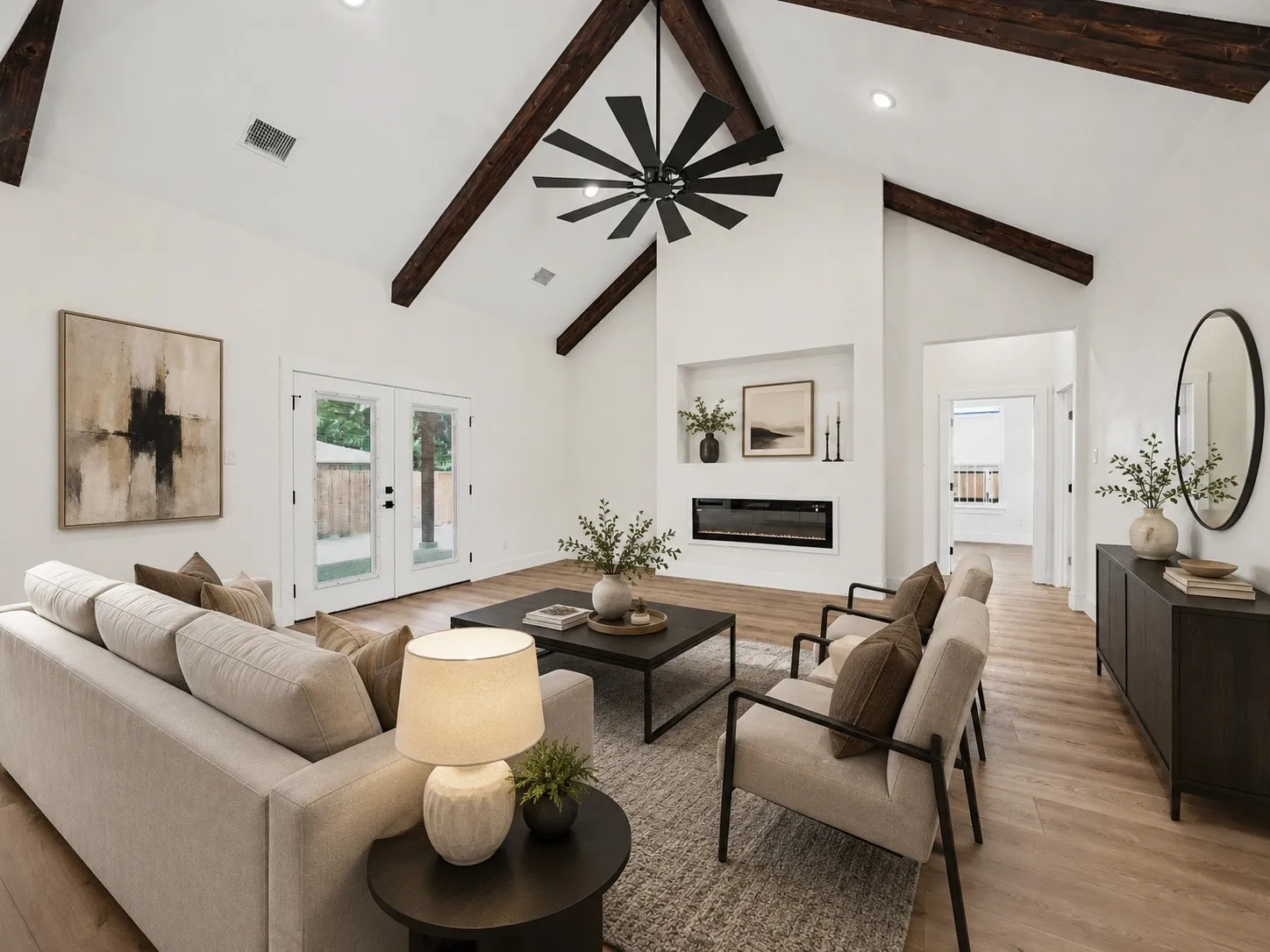 Vaulted ceiling featuring exposed wood beams, recessed lighting, and a modern ceiling fan