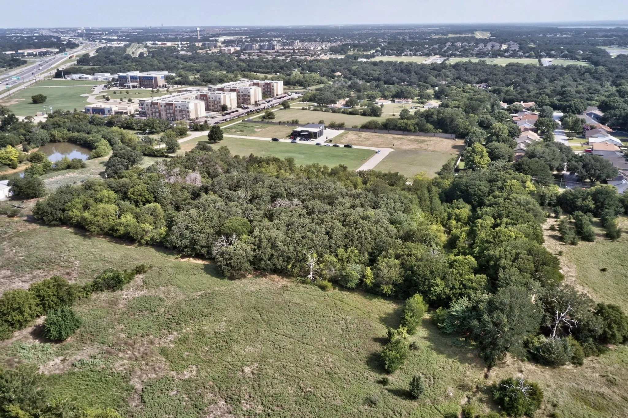 Expansive natural landscape featuring dense tree coverage