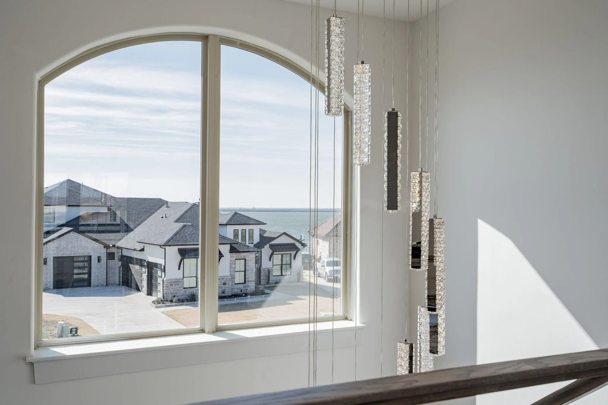 Arched window framing a water backdrop