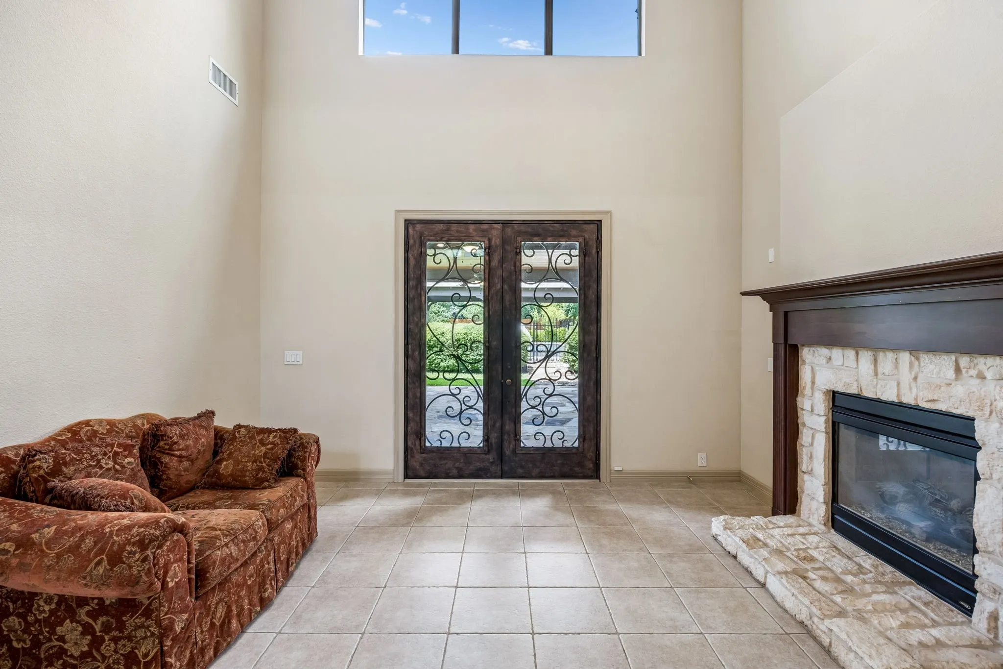 Vaulted ceiling with an upper transom window