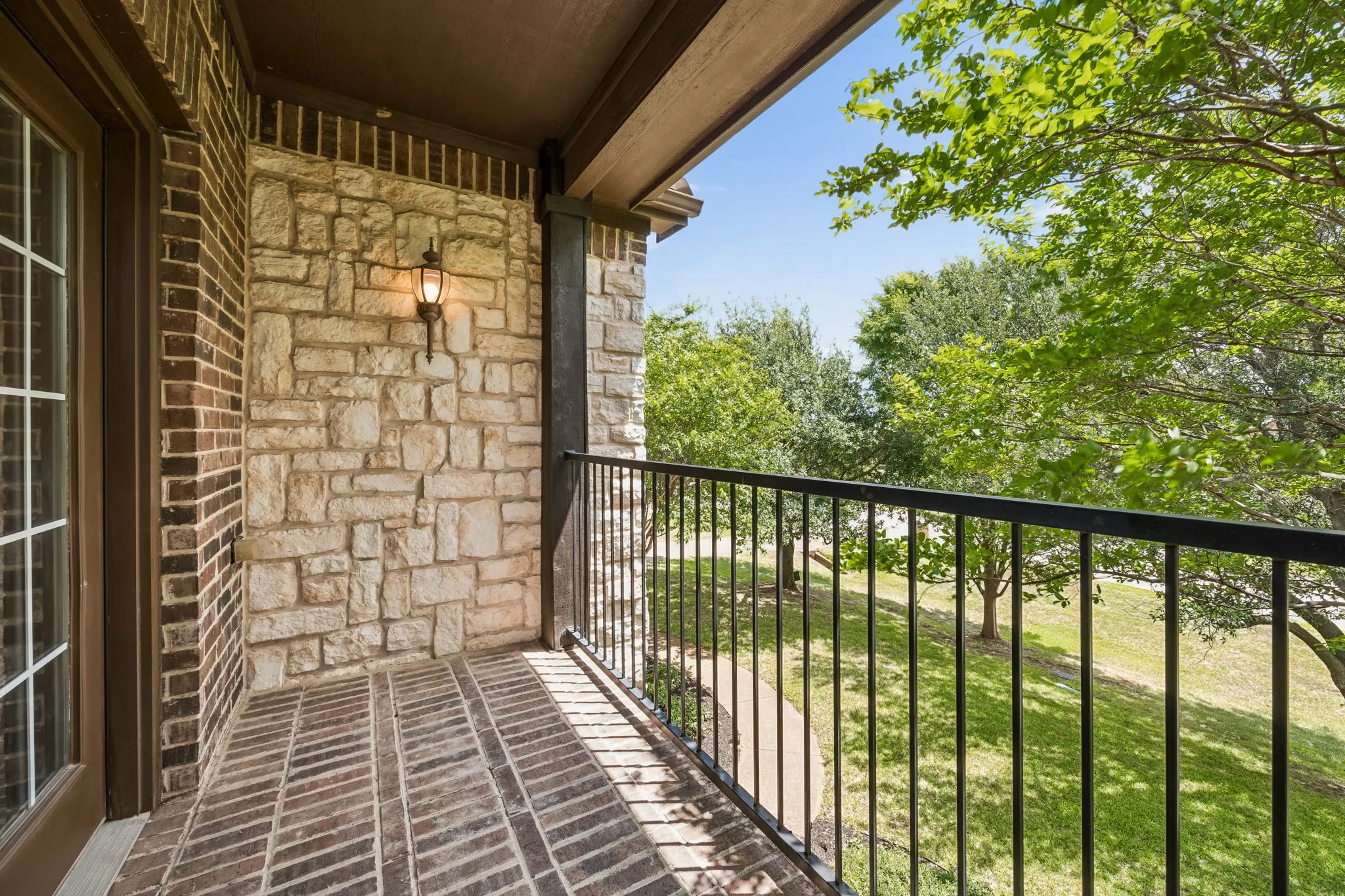 Balcony off media room facing front of the home