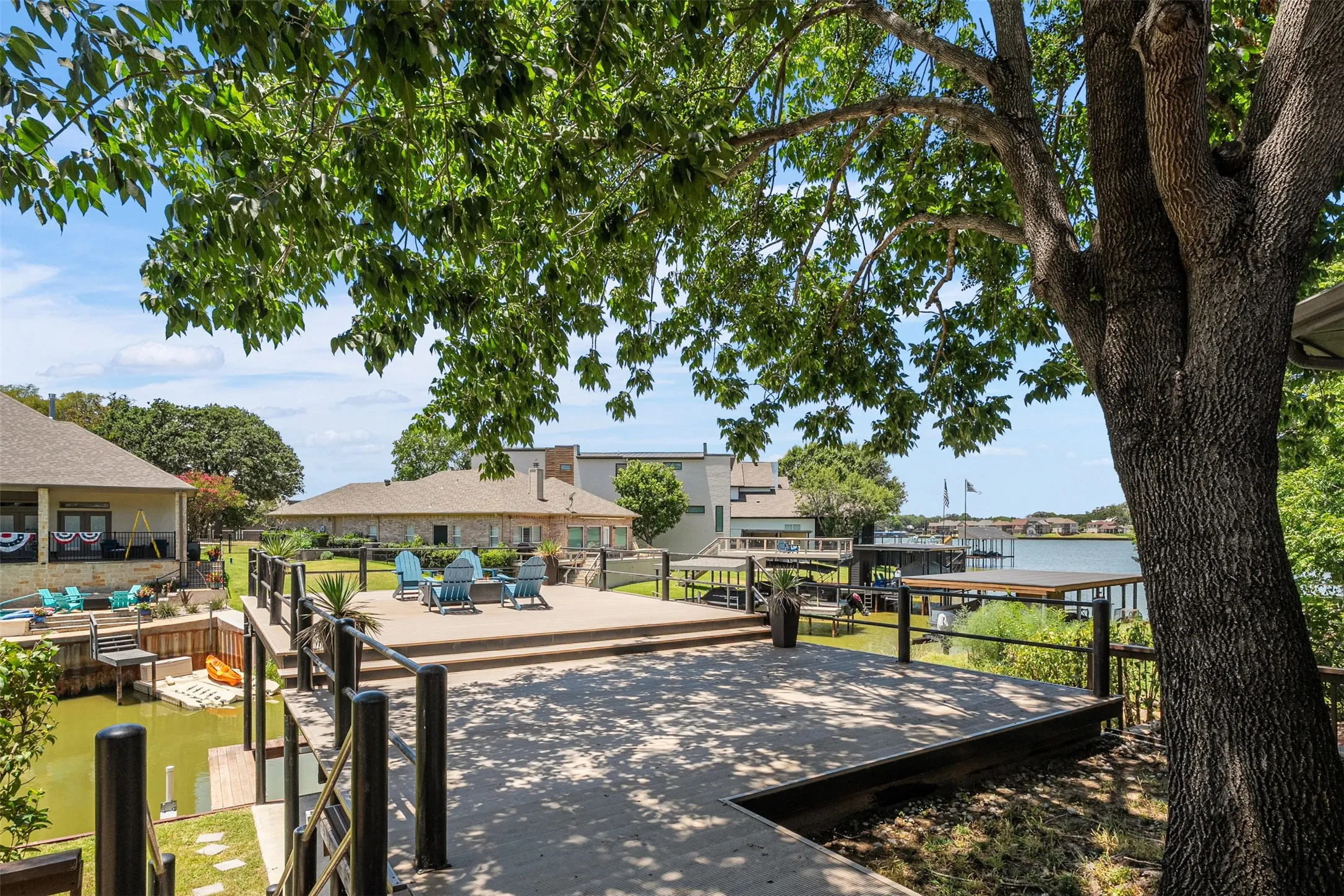 Walk-out boat dock partially shaded for those extra hot days and additional entertaining space