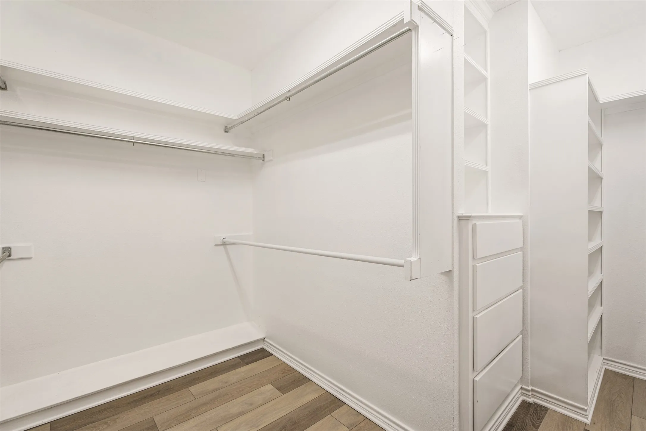 Primary walk-in closet with built-in's