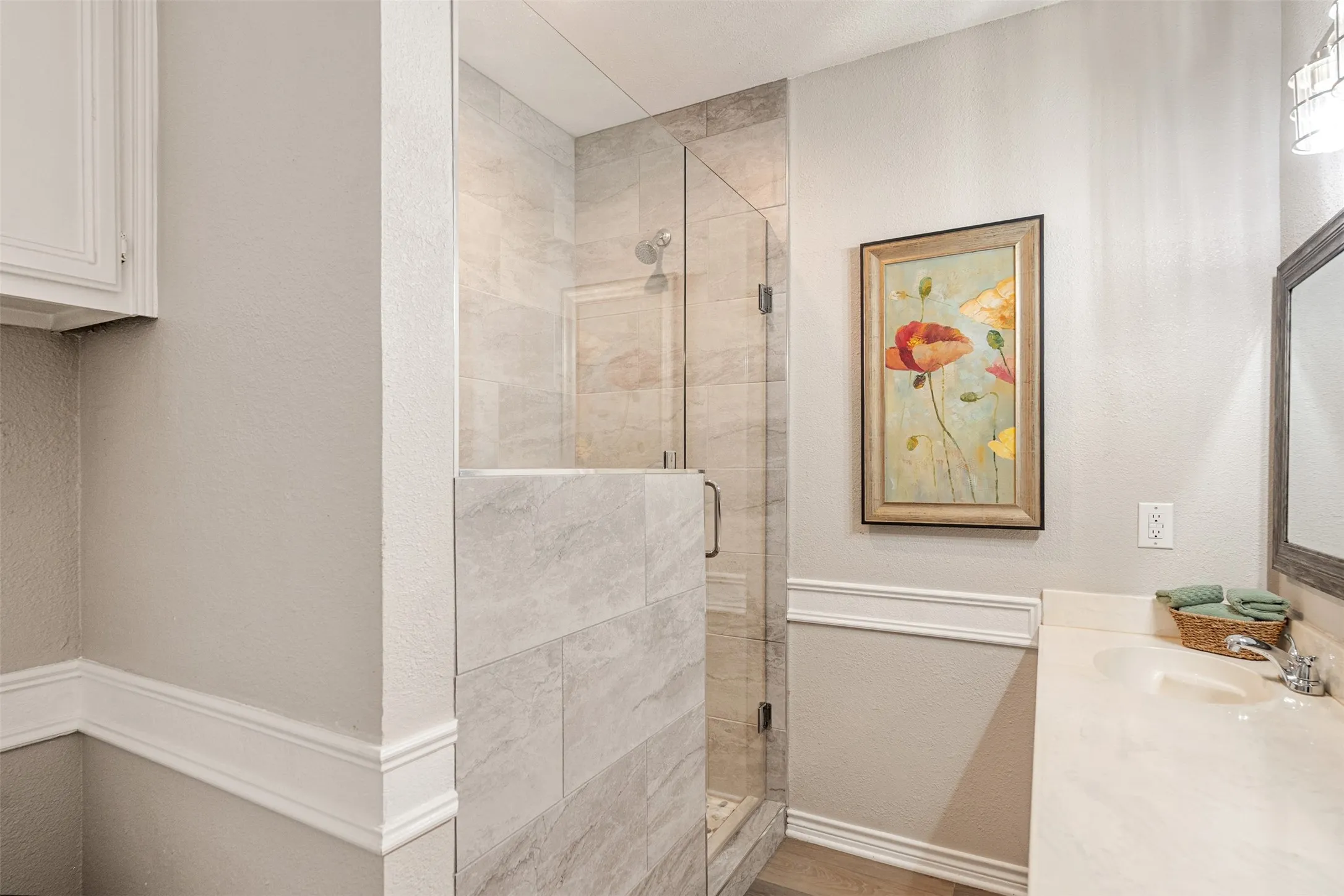 Shared bathroom with updated shower