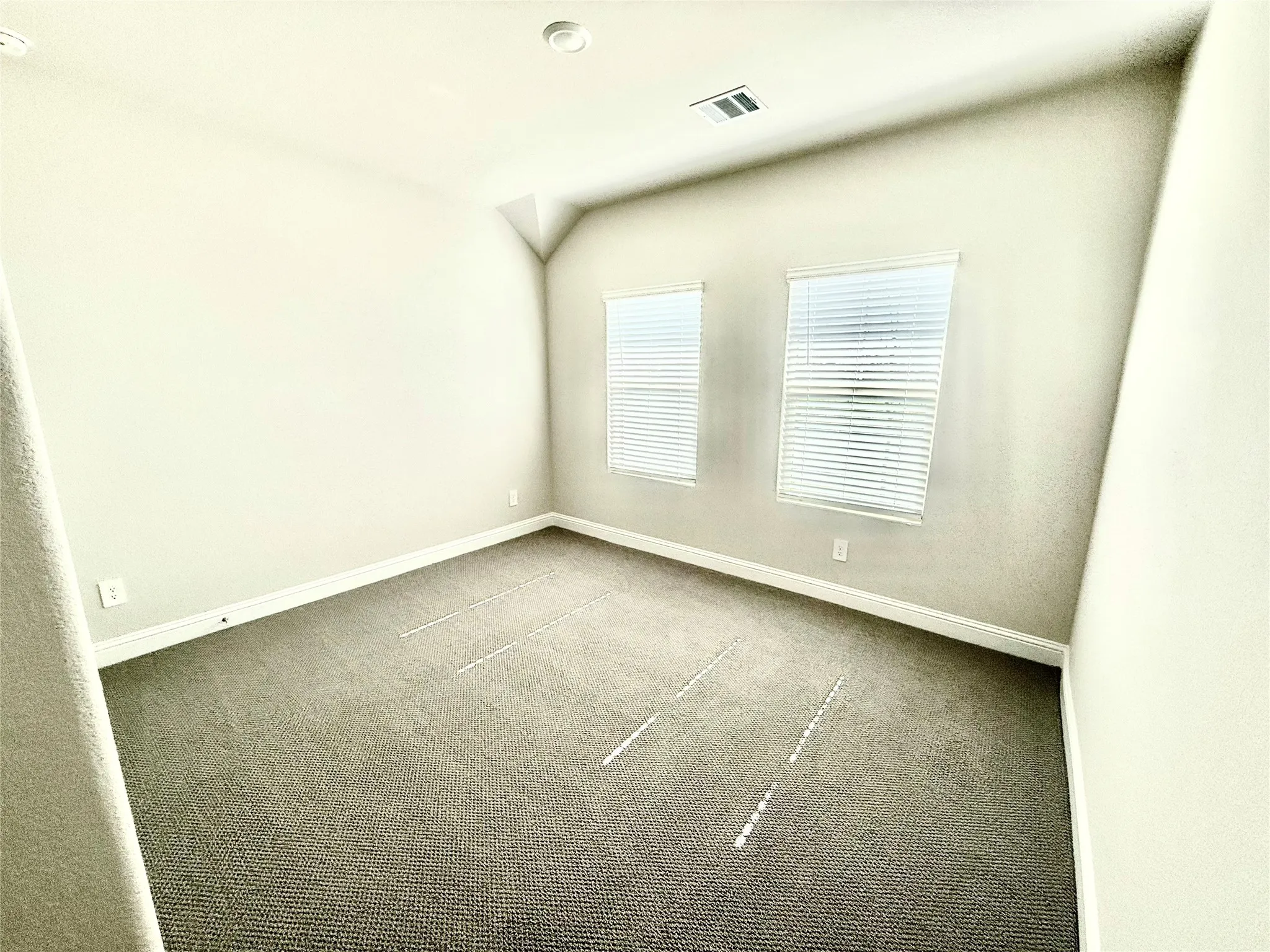 Neutral-toned wall paint and textured carpeting