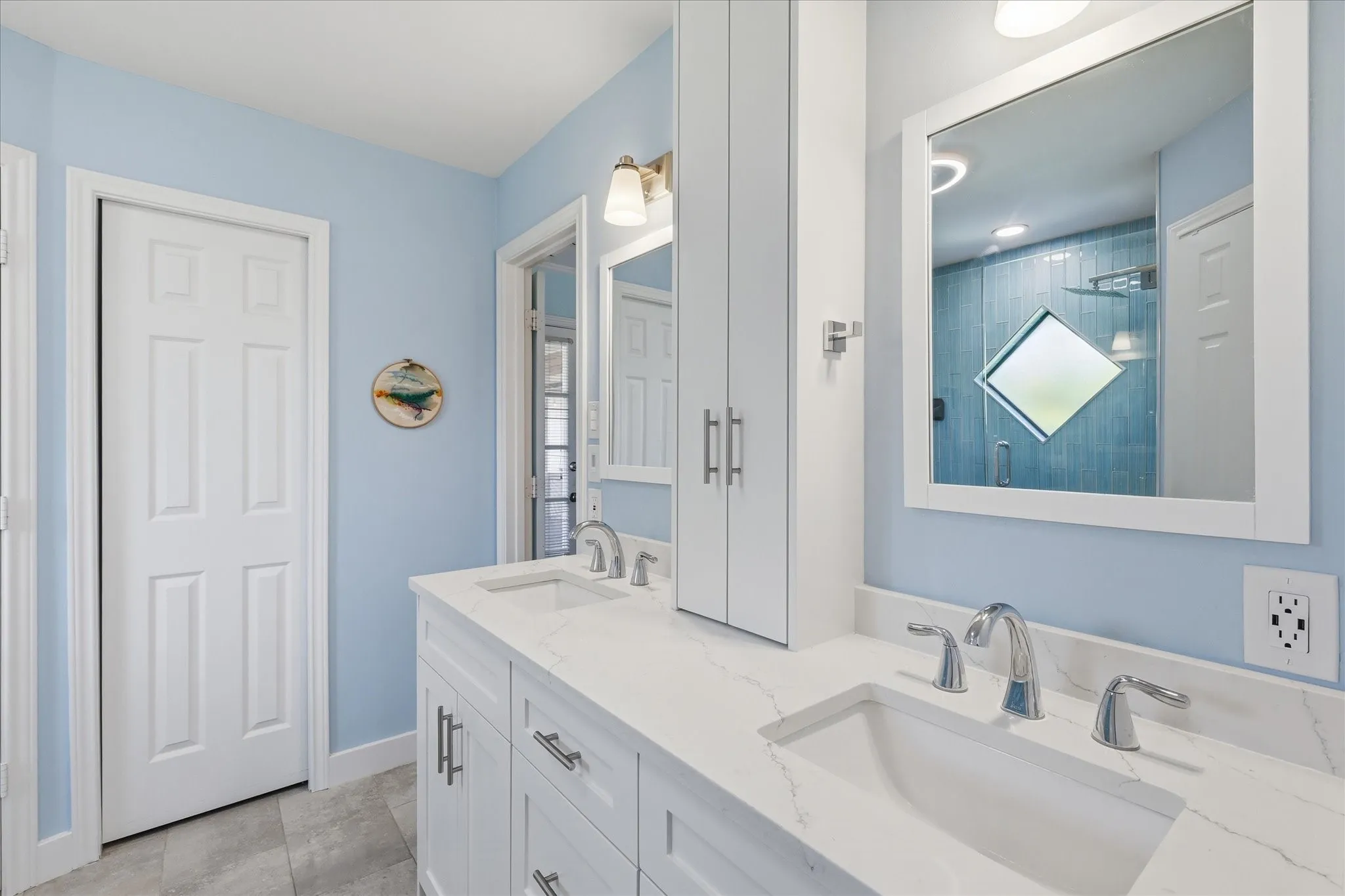 The closed door where the original shower was, is now a cedar closet with a towel warmer rack.