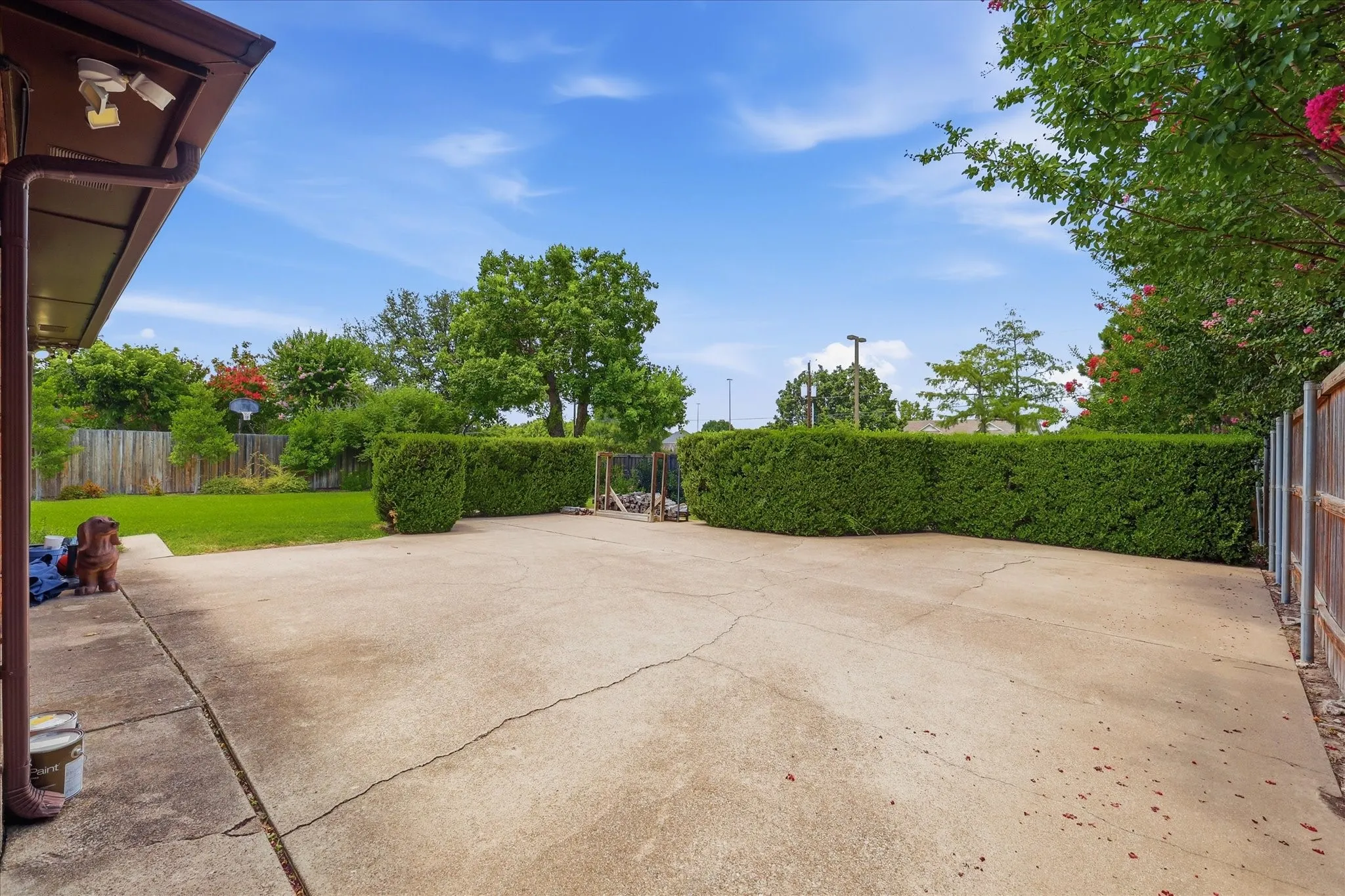 The swing in garage entry allows for room for a basketball goal or car parking.  Allow yourself to be creative.  Many possiblities.