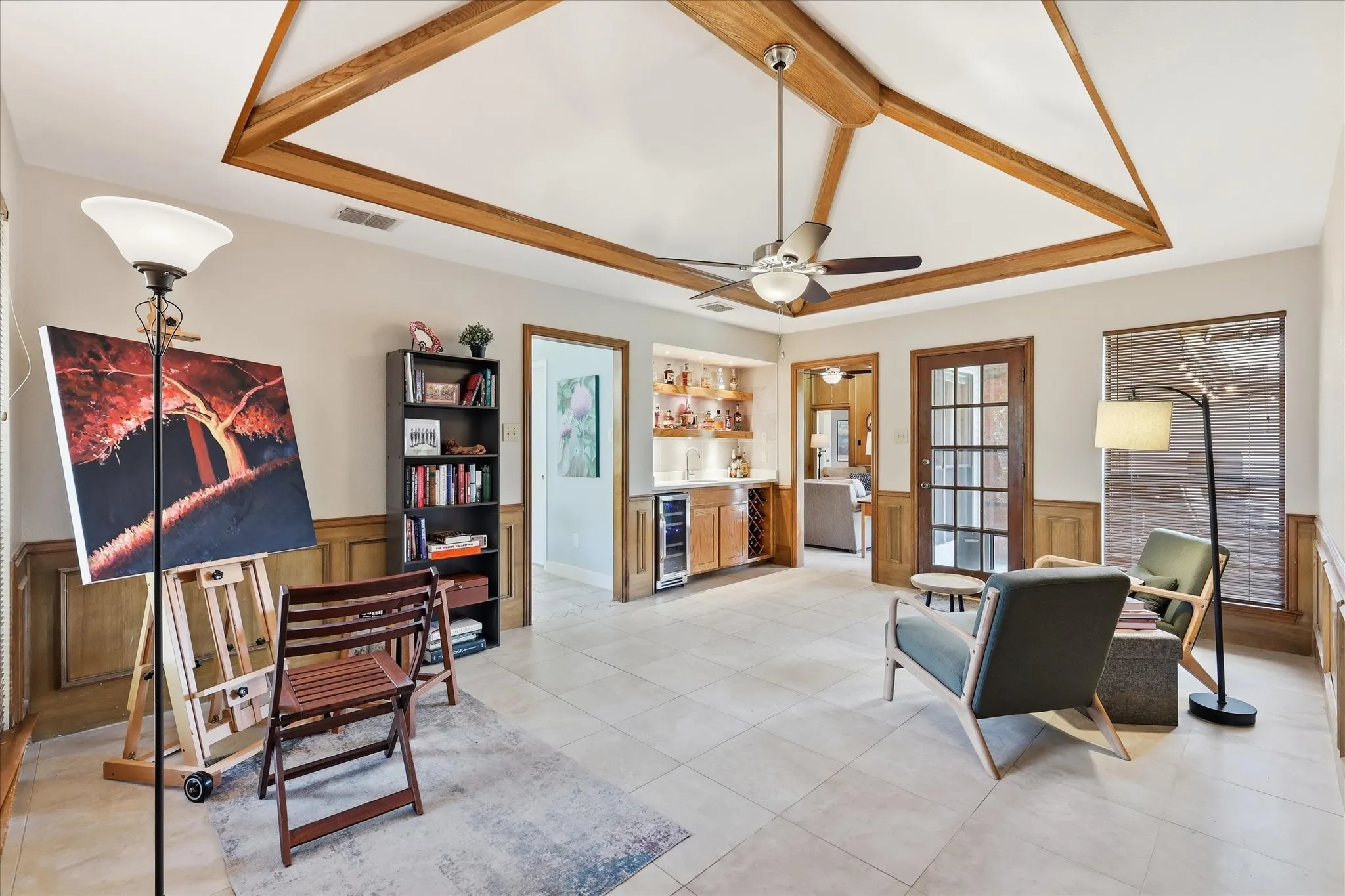 Very versatile second living space.  The sellers have used this room as a secondary living area, a dining room for holiday events, and presently as a sitting area and art studio.  Access to the wetbar adds to the entertaining value of this space.