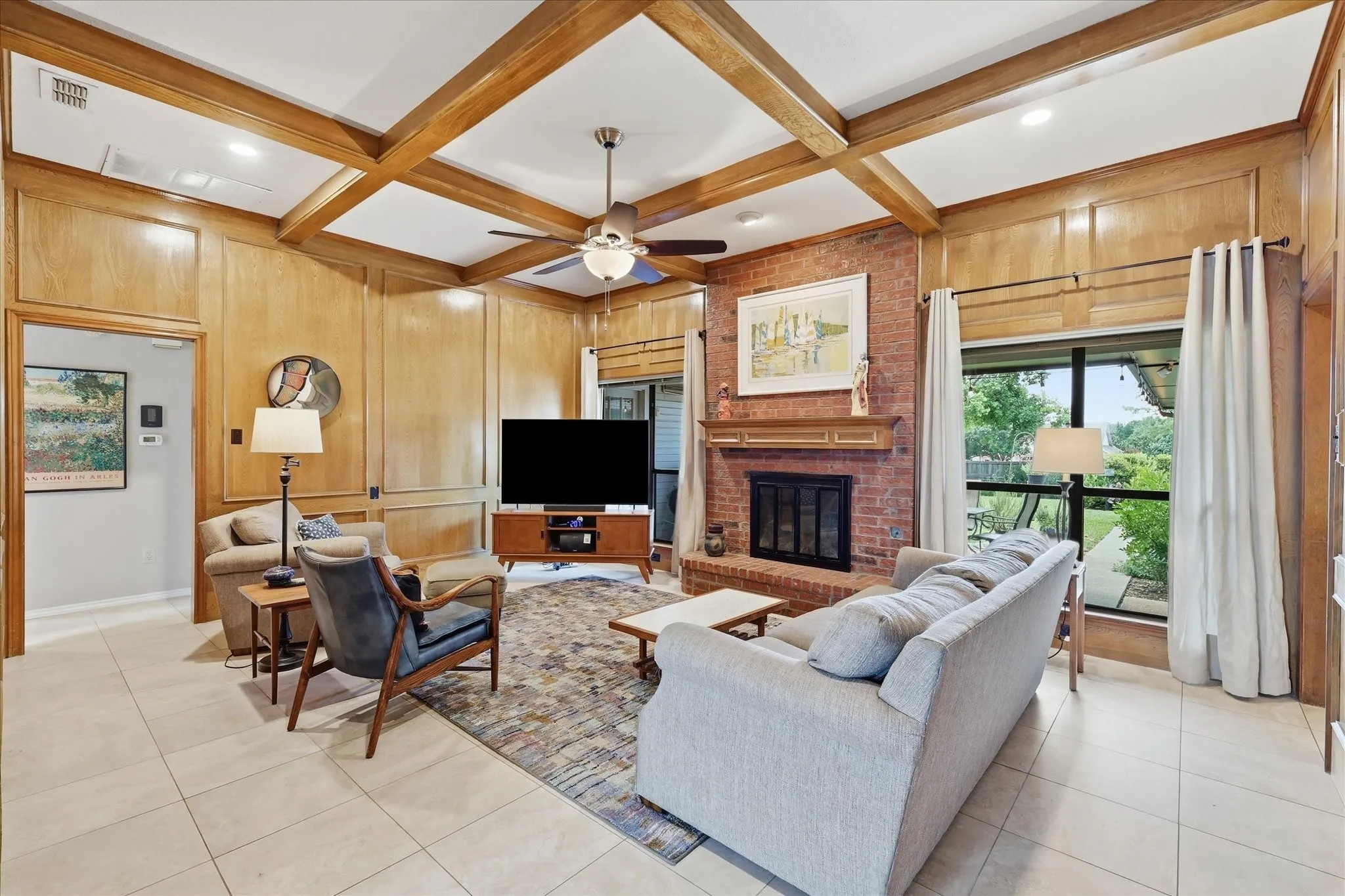 Spacious living area invites you to come in and sit a while.  Wood burning fireplace with fireplace screen and gas starter.