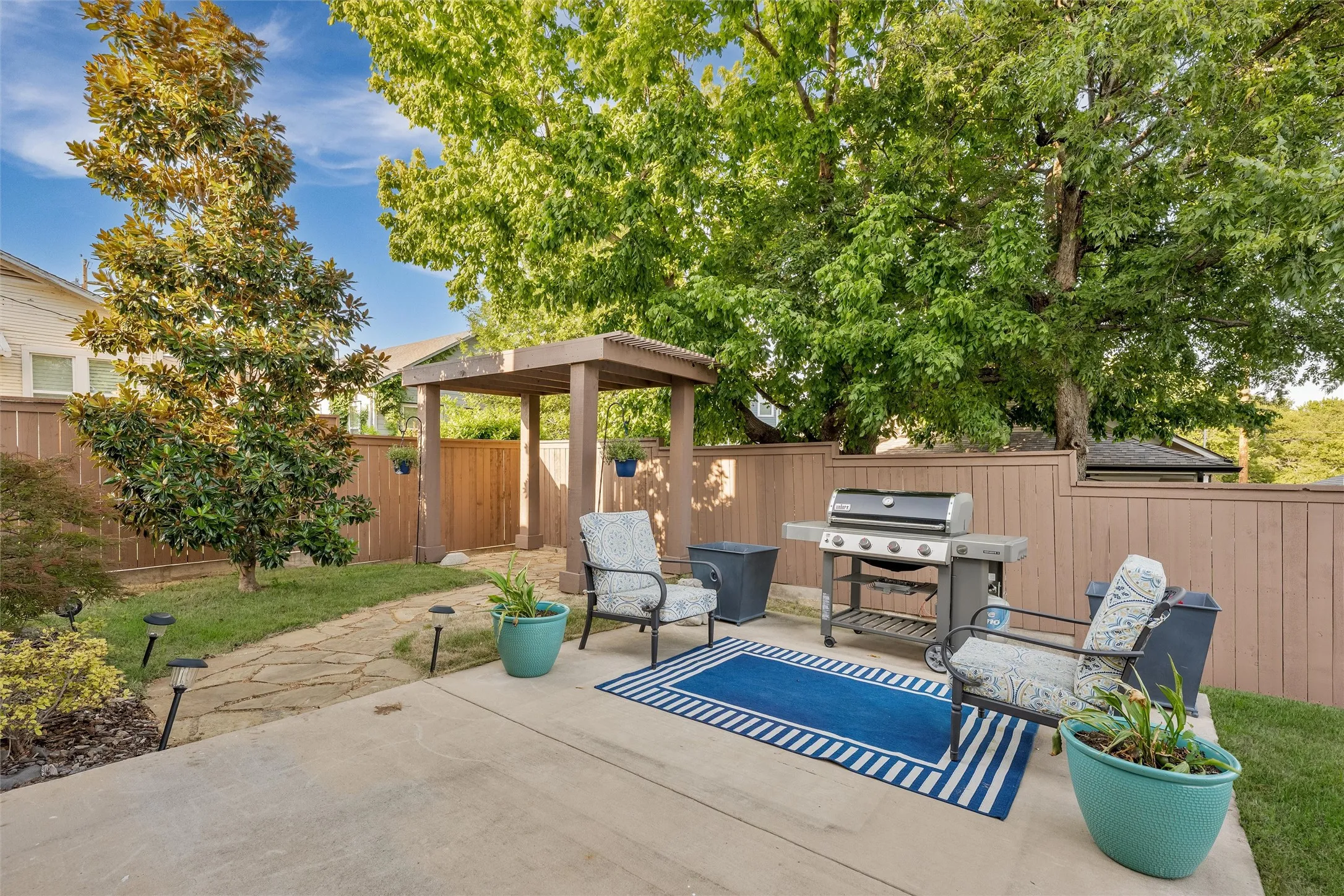 Back living area with Arbor and firepit