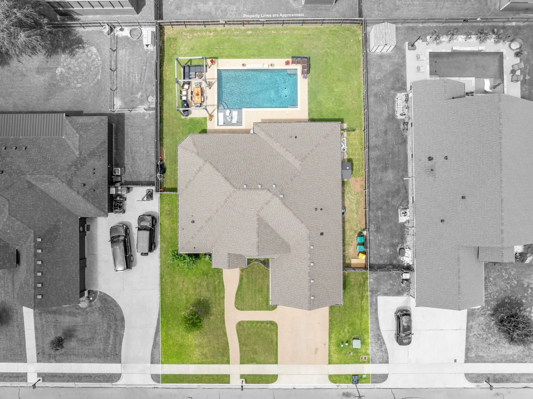 Aerial perspective showcasing a property with a distinct, multi-gabled roofline