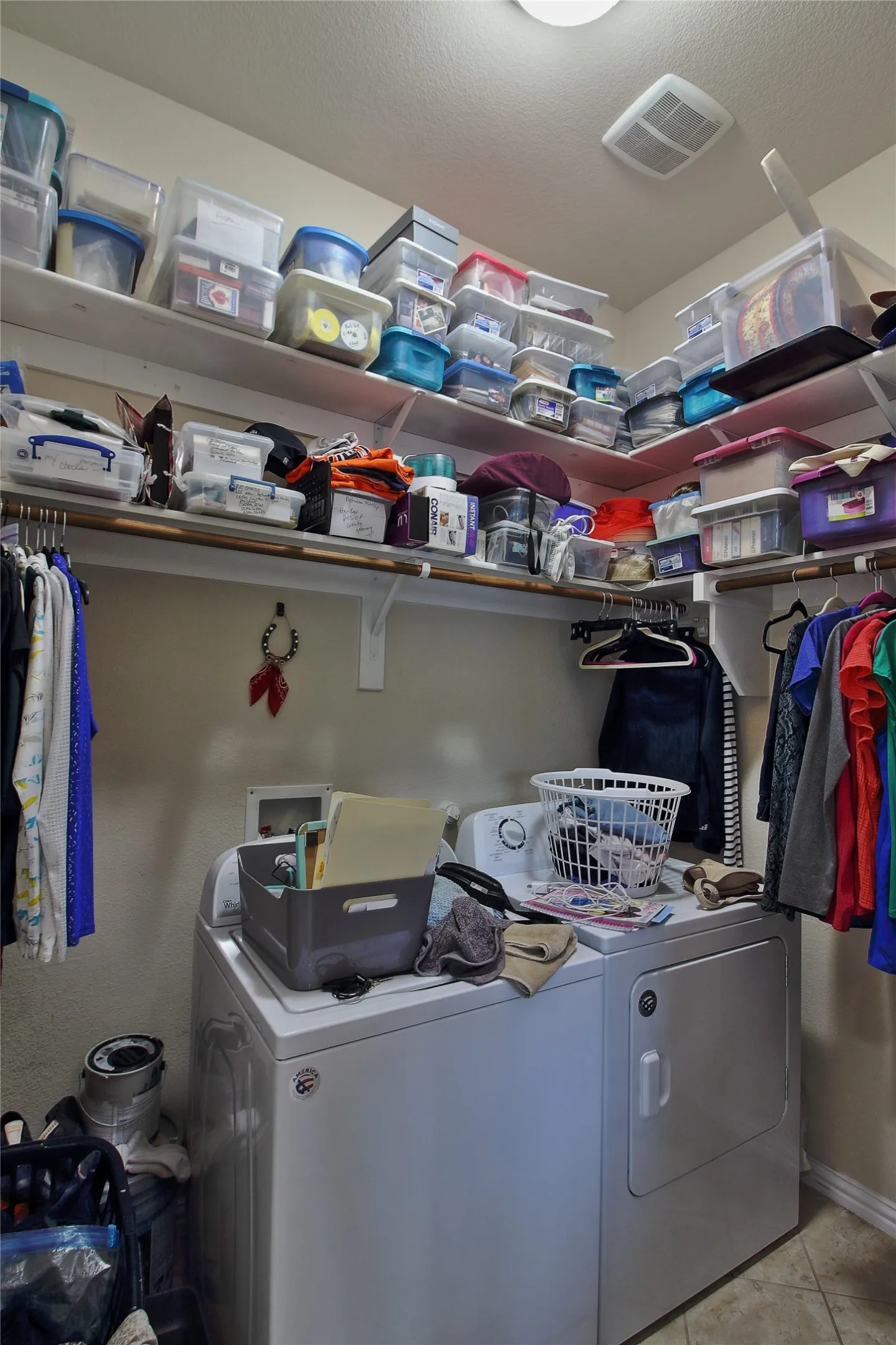 Roomy laundry room with shelving.