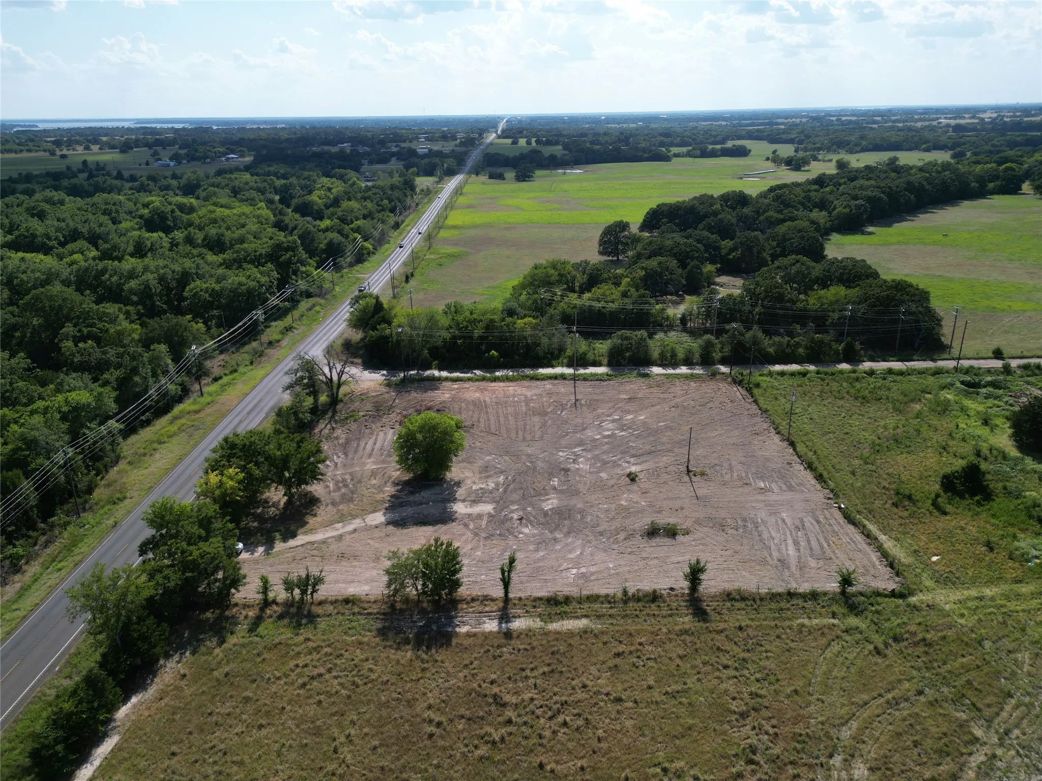 Expansive cleared lot with direct road frontage