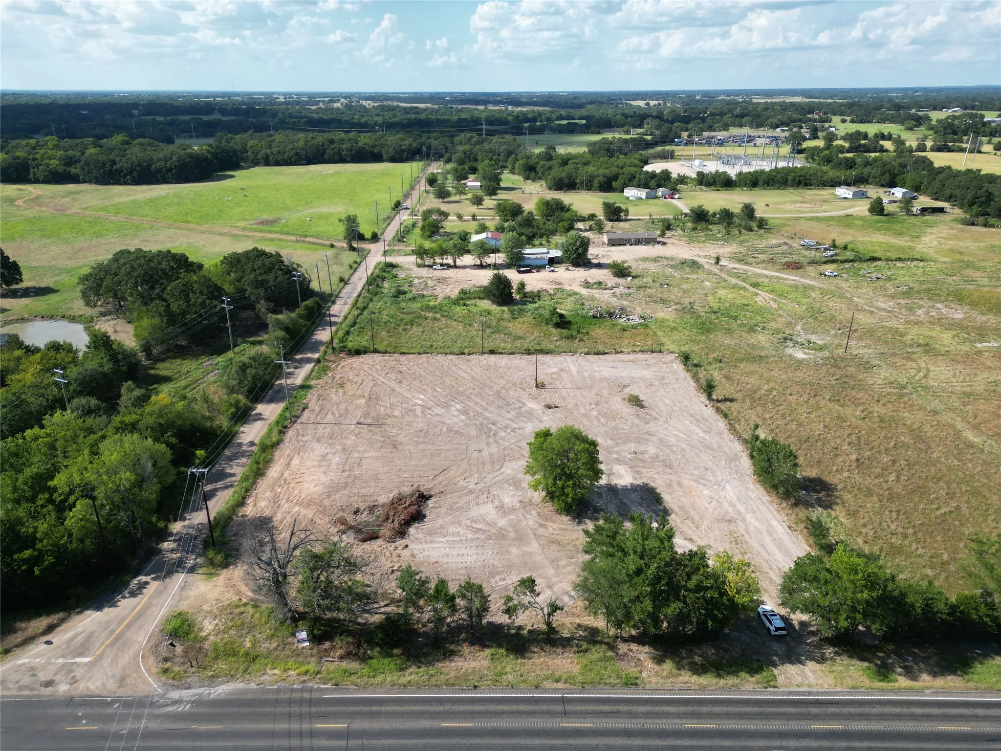 Expansive cleared land parcel offering ample development potential