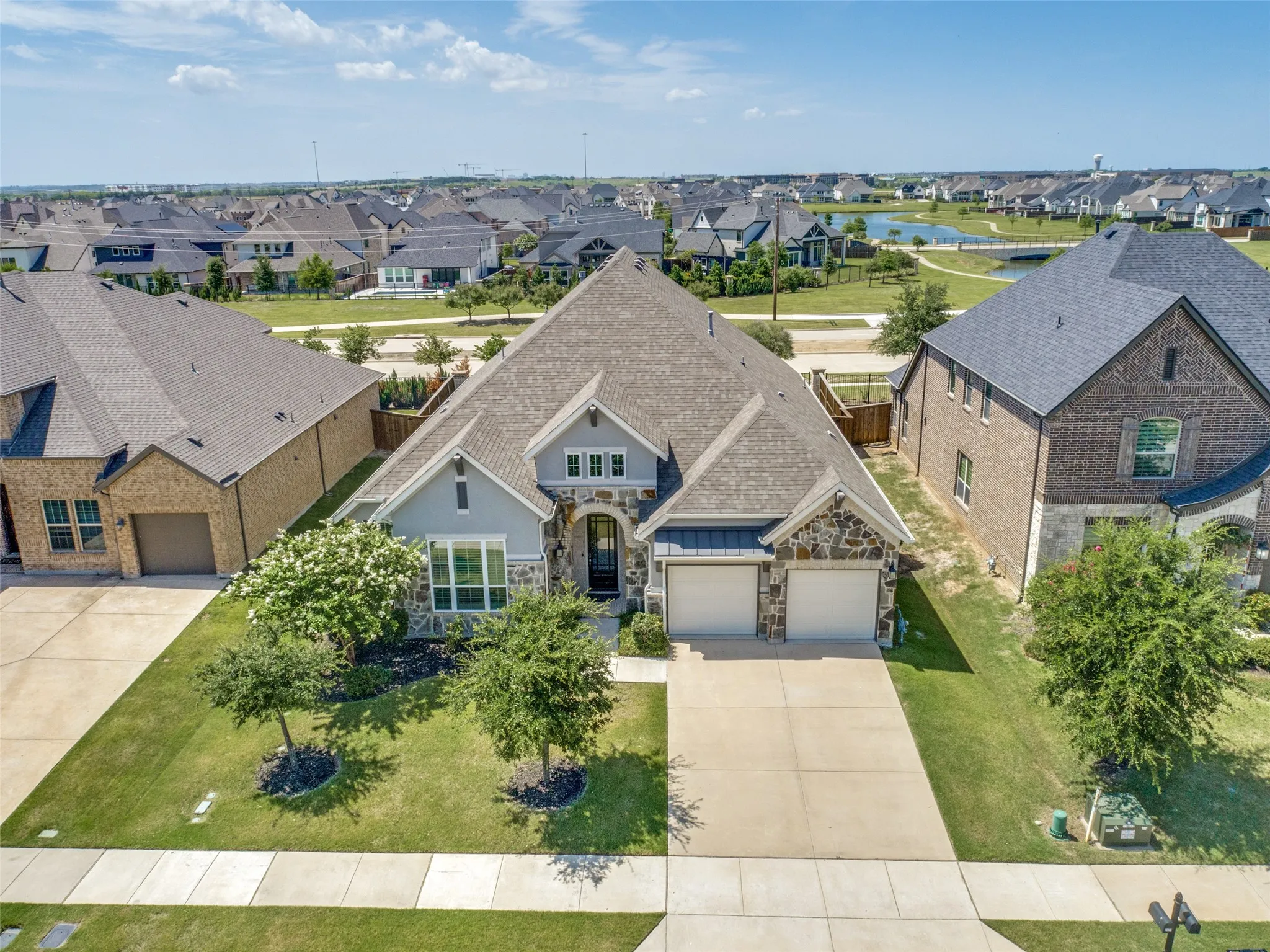 Established trees and landscaping frame the charming exterior of this home!