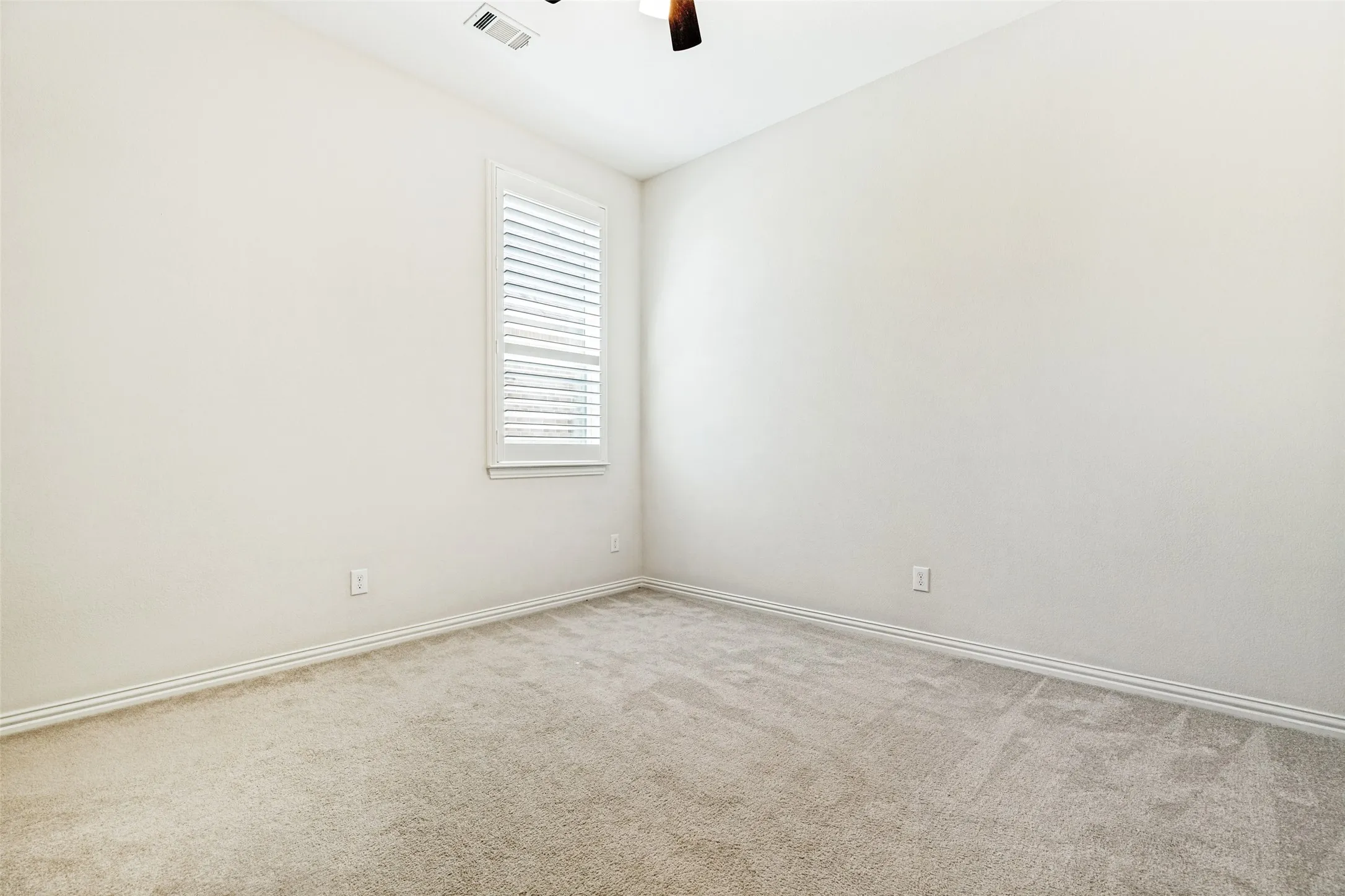 Neutral-toned carpeting throughout