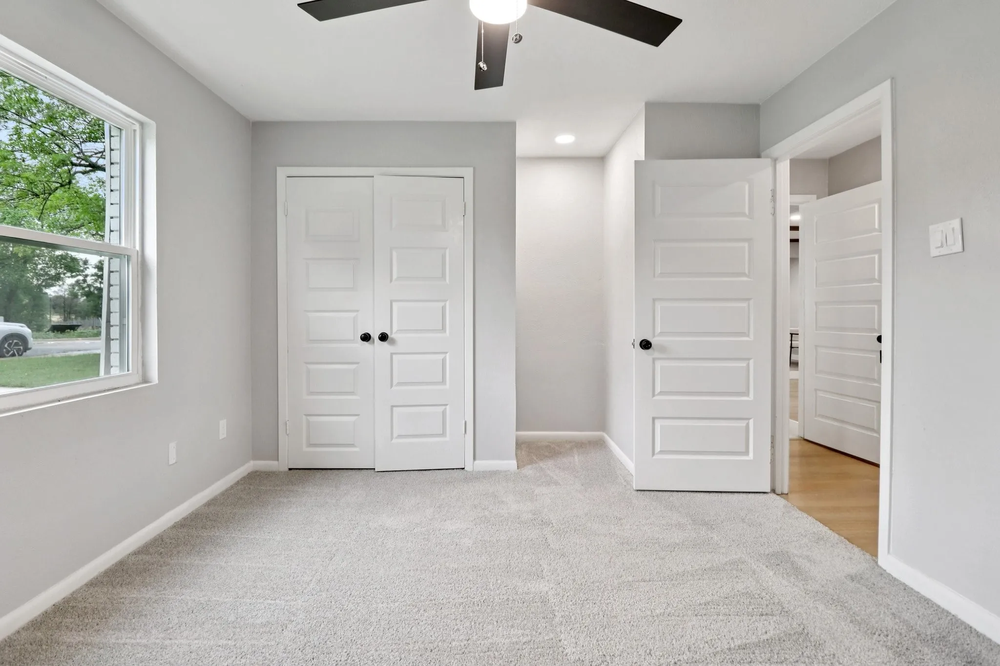 Light grey carpeting and walls create a neutral palette