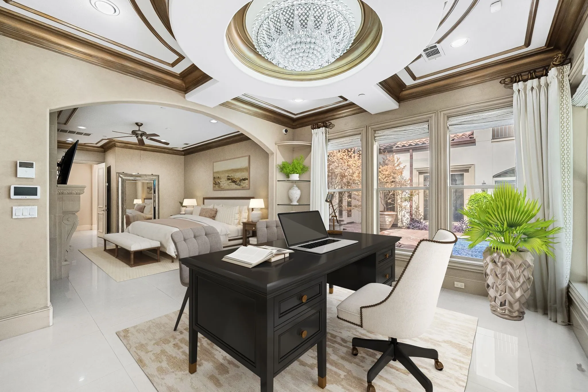 Tray ceiling with ornate crown molding and a crystal chandelier