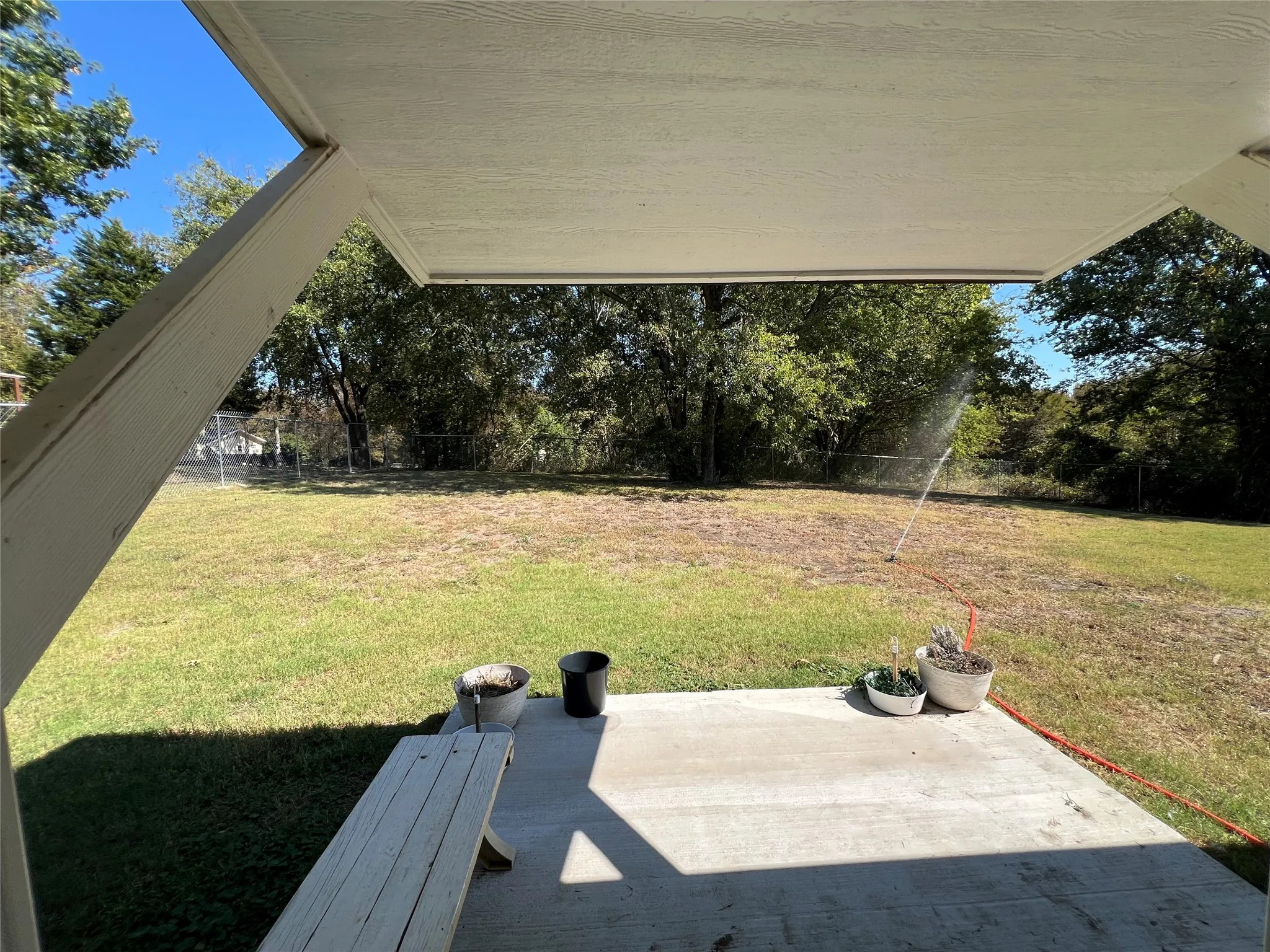 Covered patio with a concrete surface