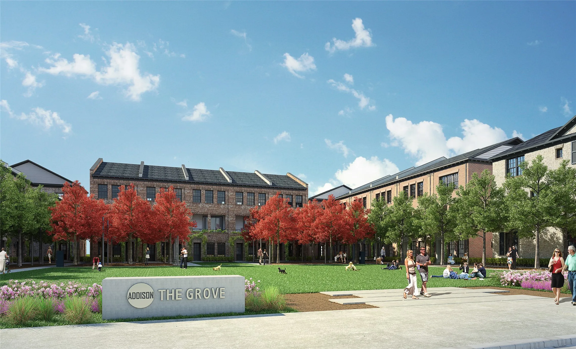 Central green space featuring a manicured lawn, established trees, and seasonal plantings