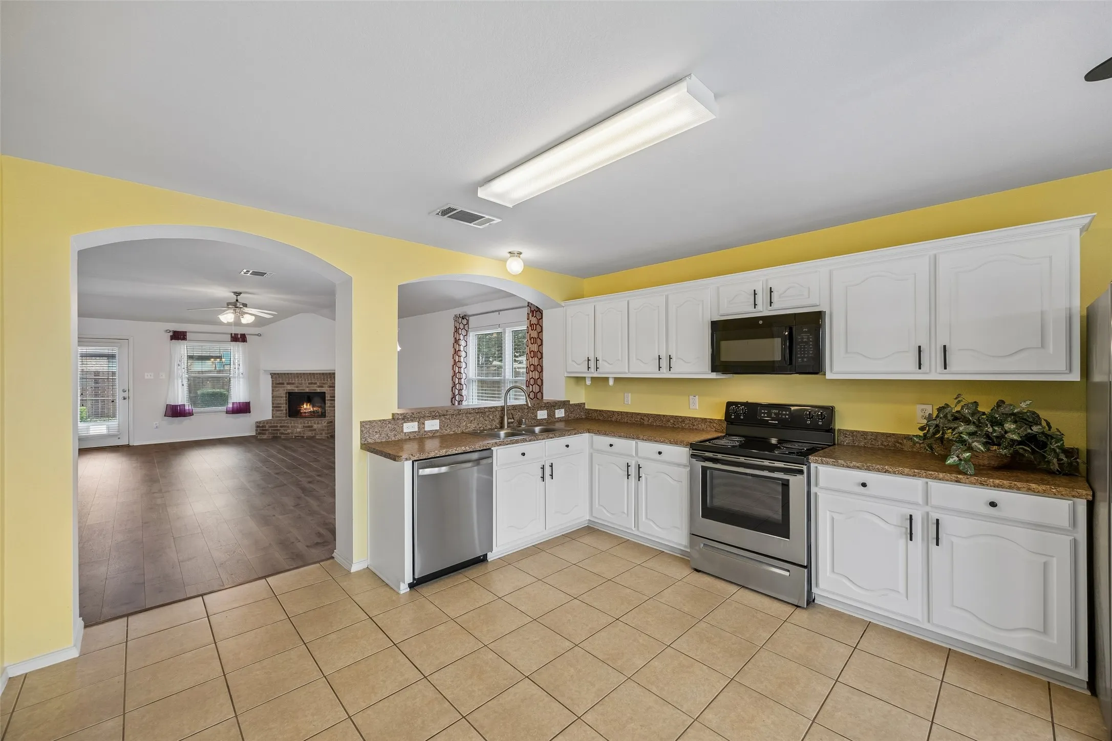 The kitchen opens seamlessly to the dining and living areas, creating a spacious, connected layout that's ideal for entertaining and everyday living.