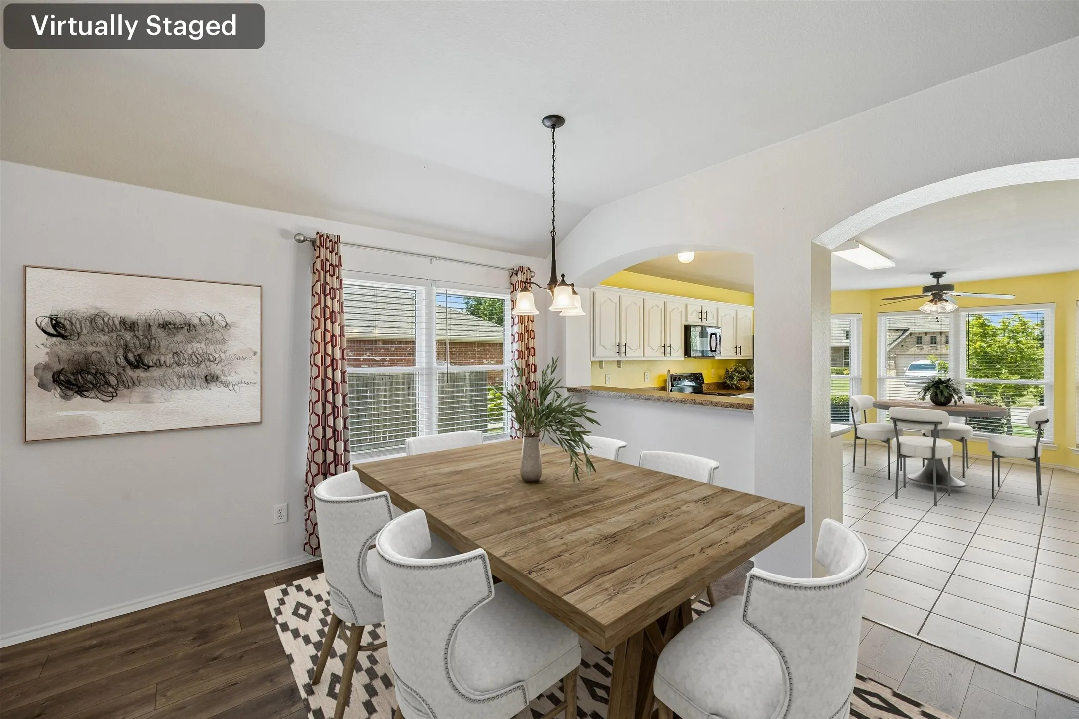 Enjoy an open-concept dining space that connects beautifully to the kitchen, creating a comfortable setting for everyday living and entertaining. (Virtually staged.)