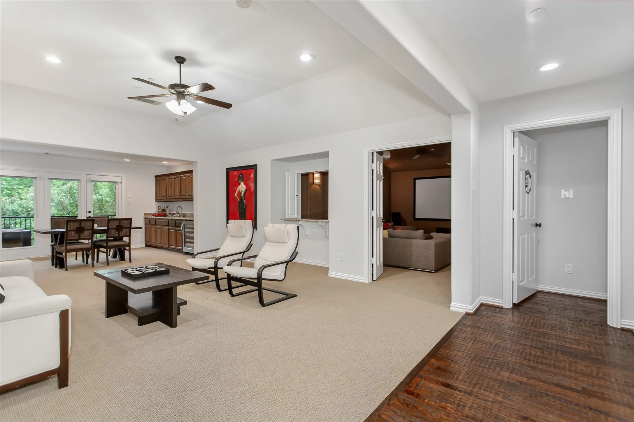 Expansive open-concept living area featuring recessed lighting and a ceiling fan