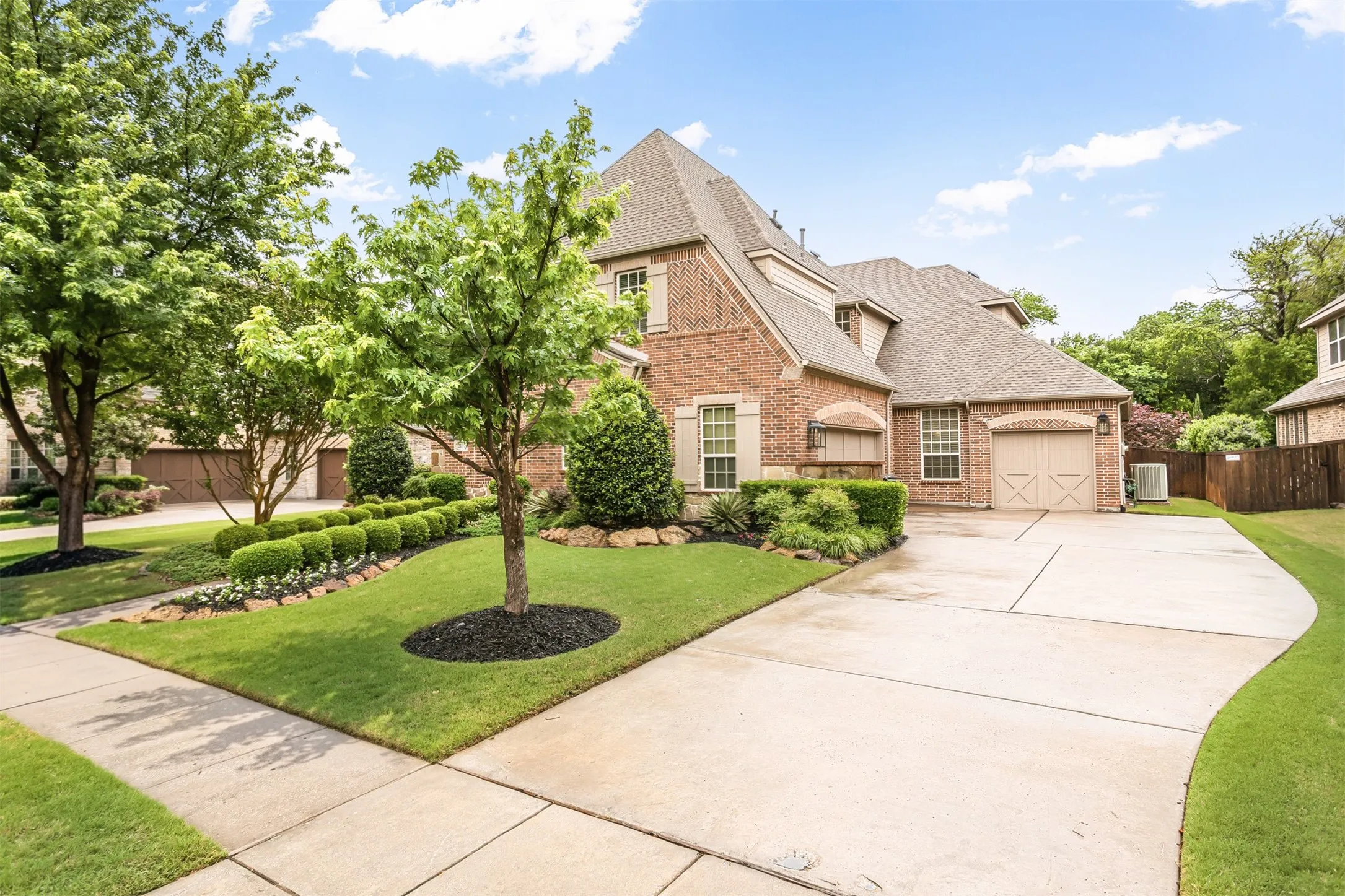 Brick exterior with decorative shutters and a gabled roofline