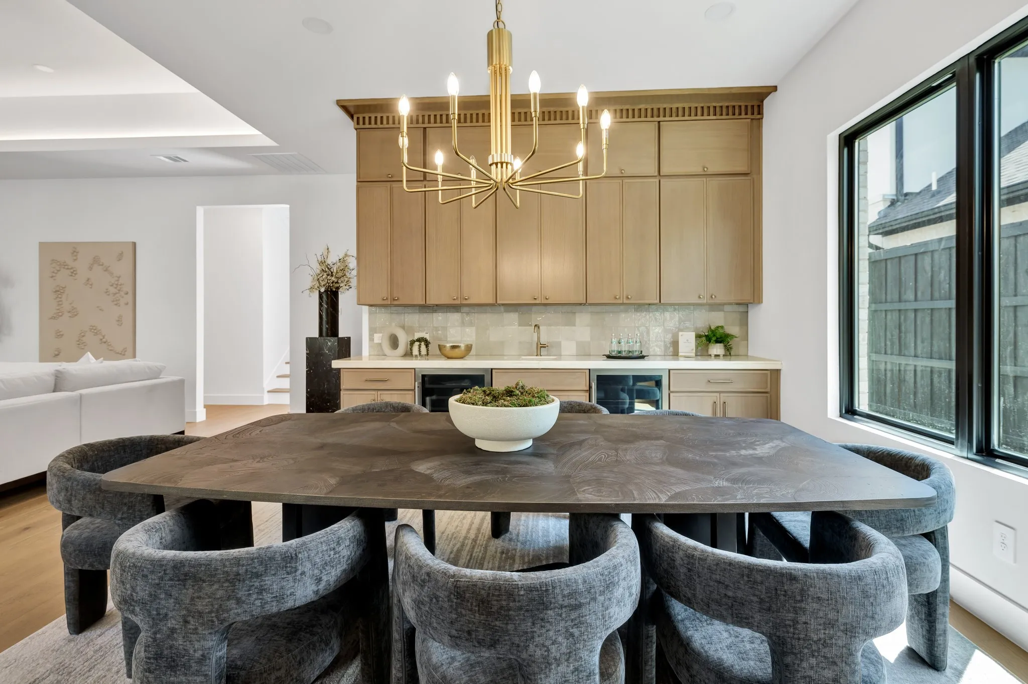 Dining area with wetbar. Cristallo quartz countertops backlit with LED lights