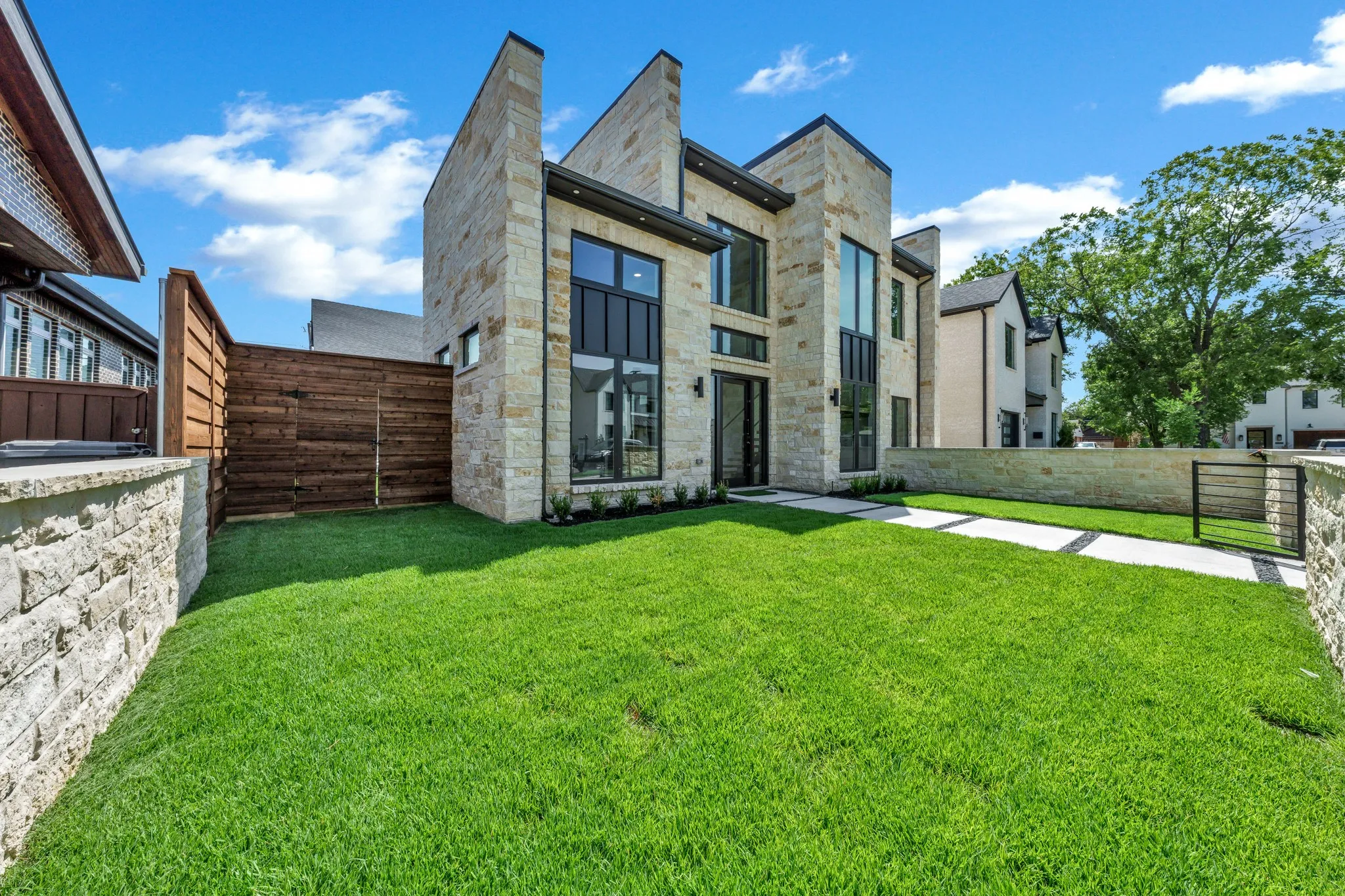 Enclosed front courtyard. connects to yard, gated garage entry off alley, and side yard