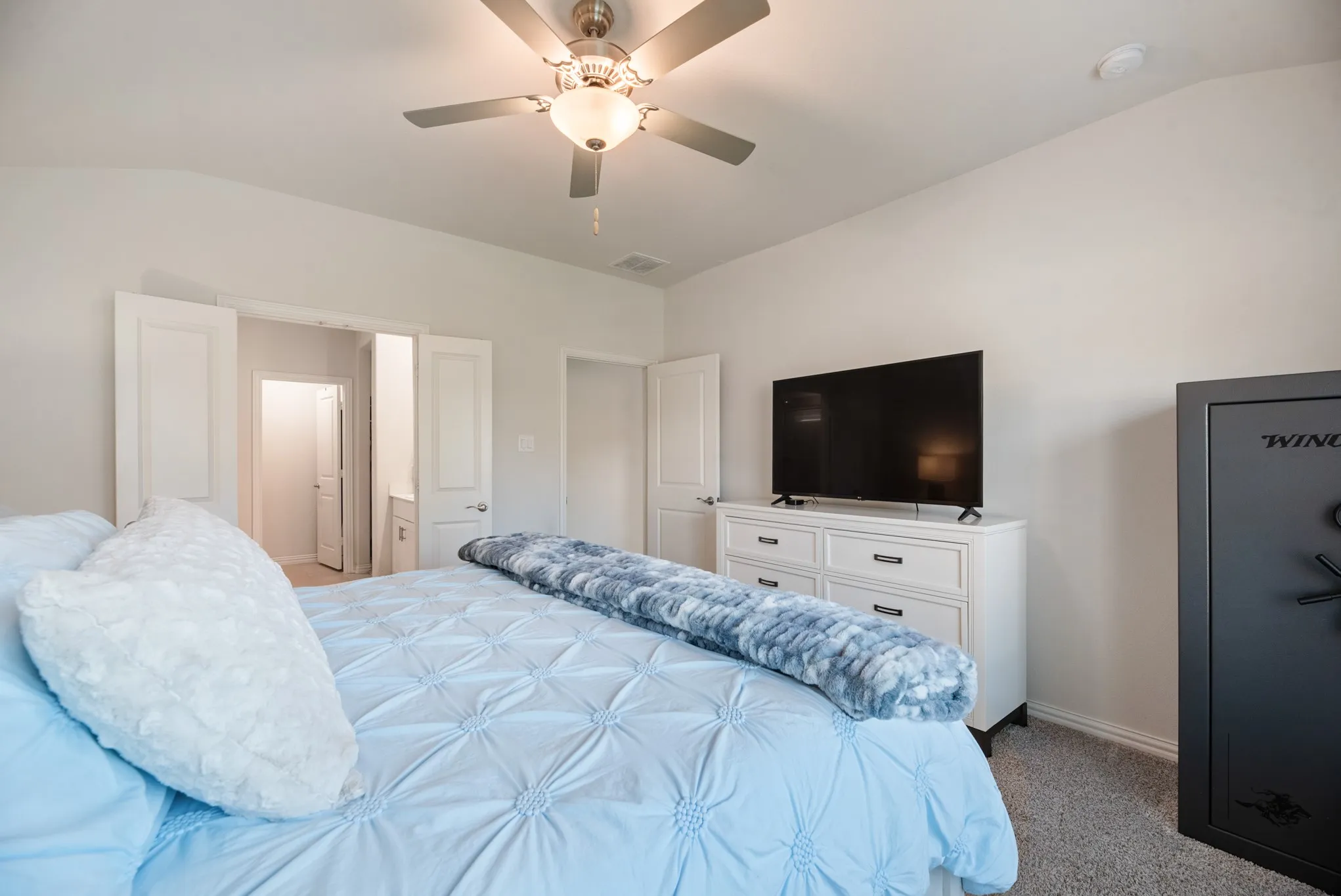 Recessed ceiling with a modern ceiling fan featuring integrated lighting