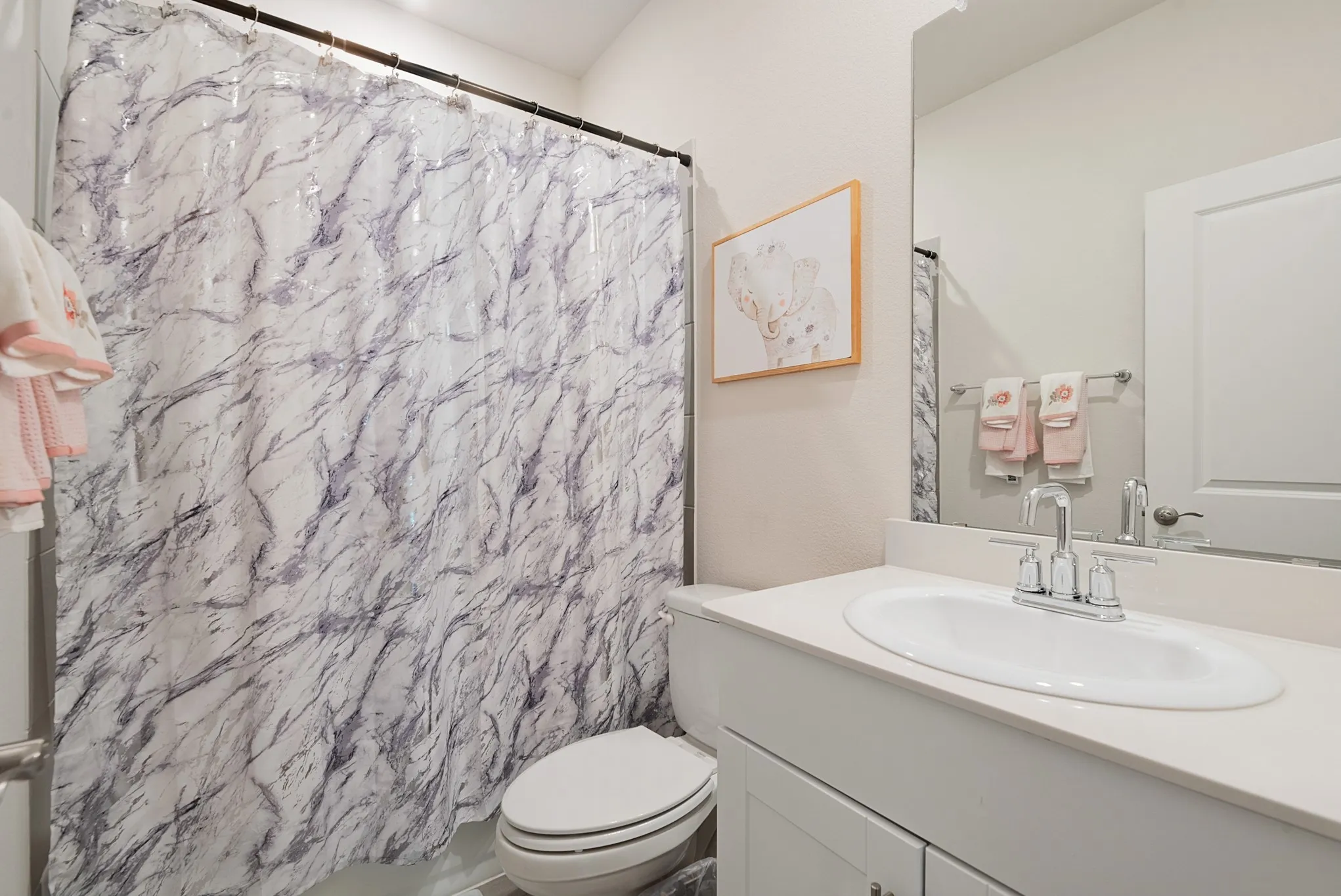 Full bathroom with a single vanity, undermount sink, and a chrome faucet