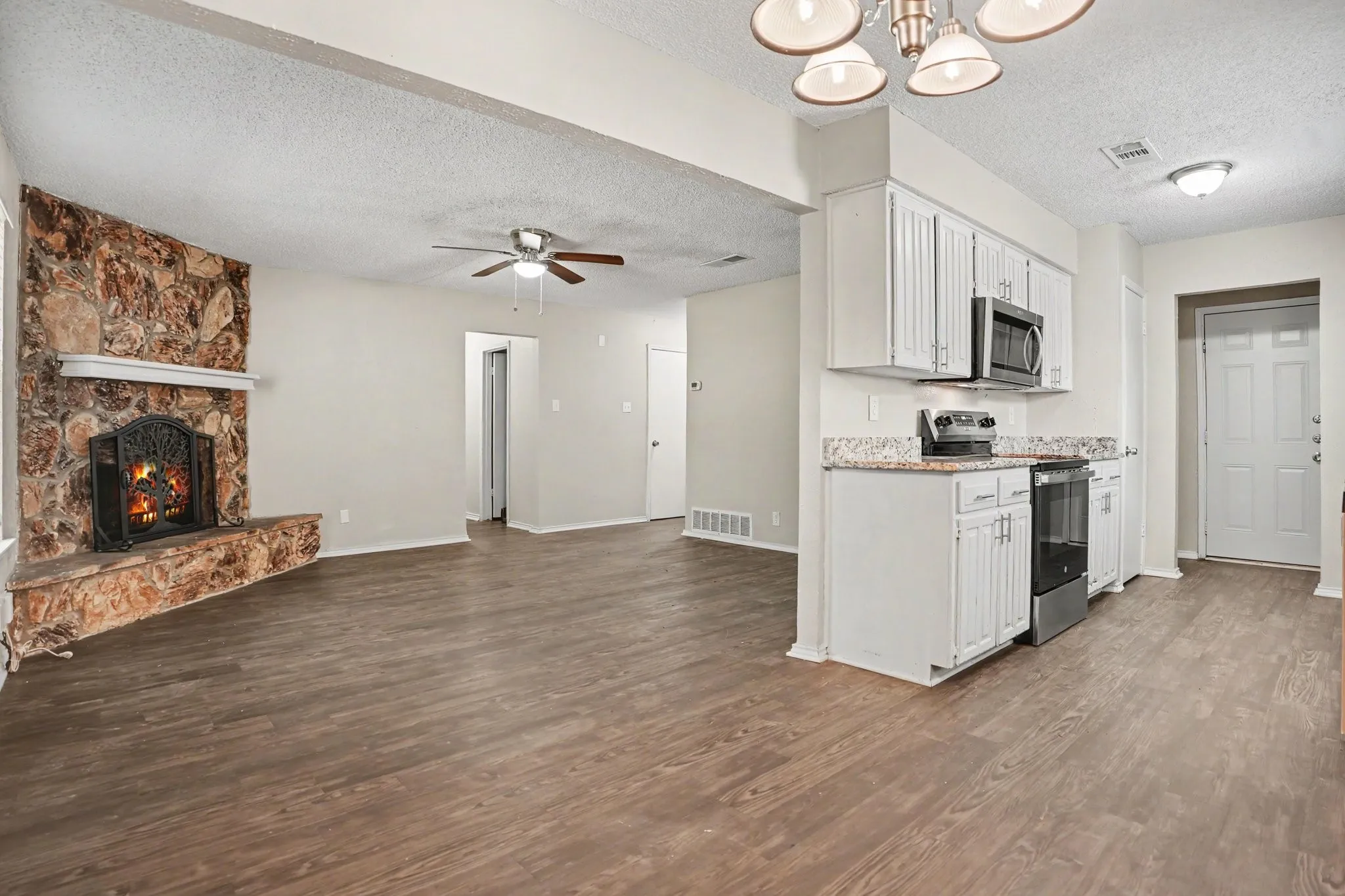 View from dining area capturing living and kitchen.