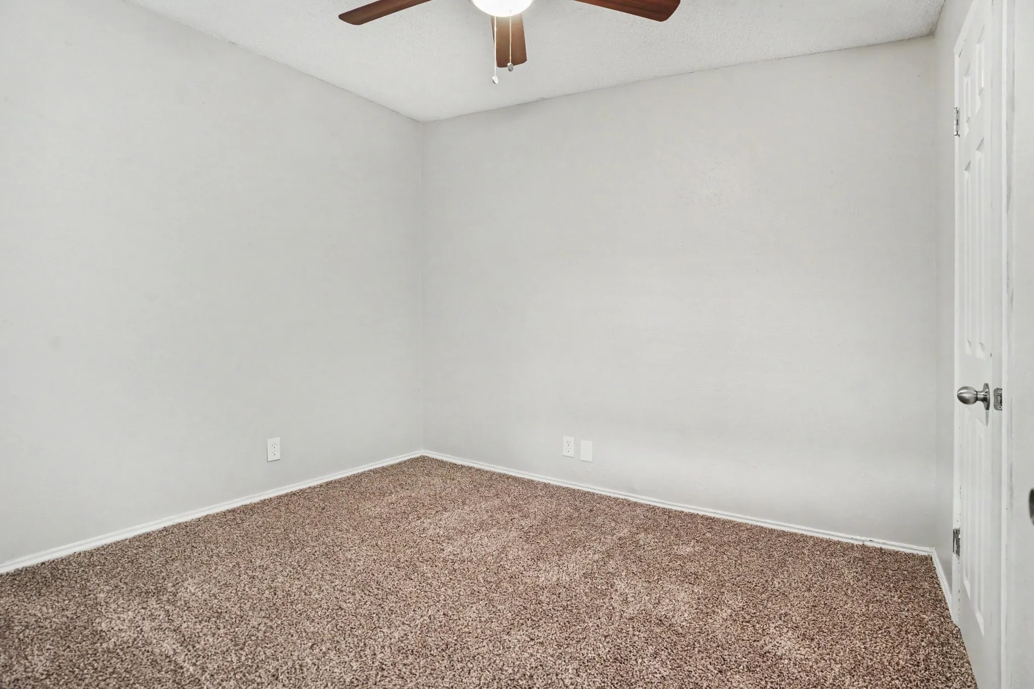 Bedroom #4 by front entrance. Versatile may be used as an office.