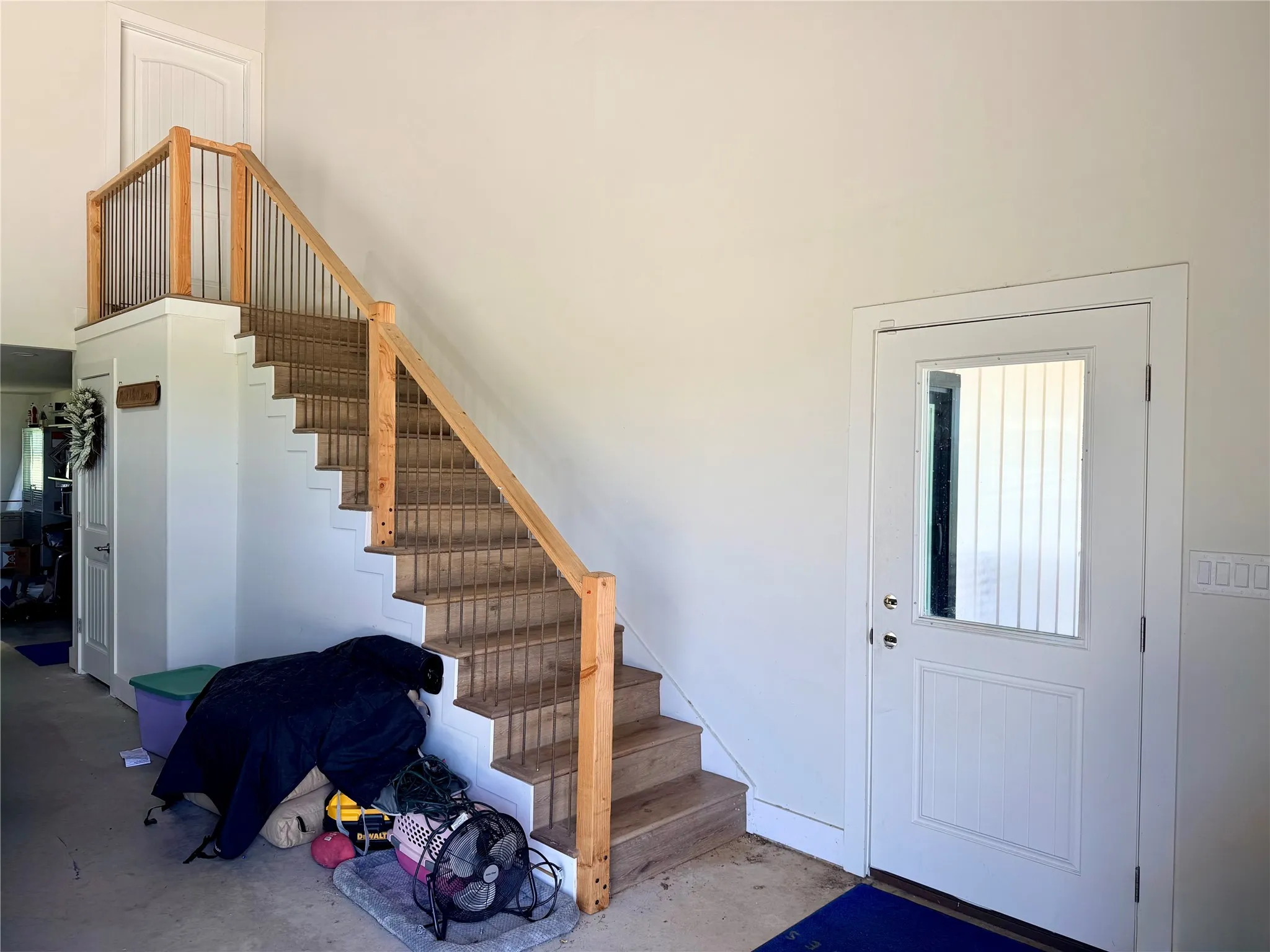 Step inside your ground-floor entrance, featuring a foyer and a beautiful wooden staircase leading straight up to your personal living oasis.