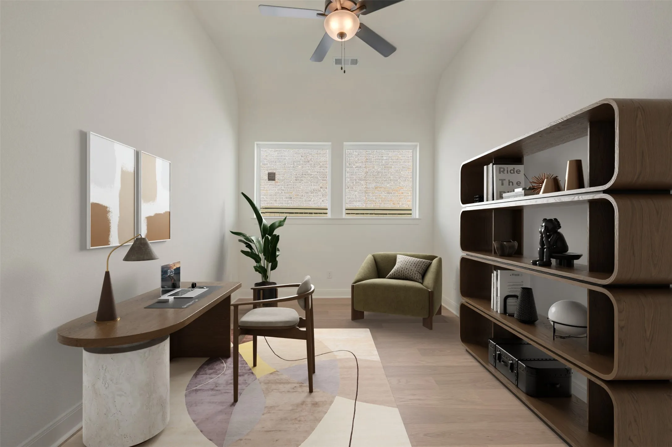 Vaulted ceiling with a ceiling fan, light wood-finish flooring, and two windows