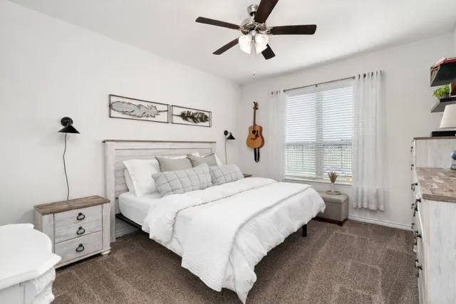 Primary Bedroom on first floor with views to greenbelt and backyard - so peaceful!
